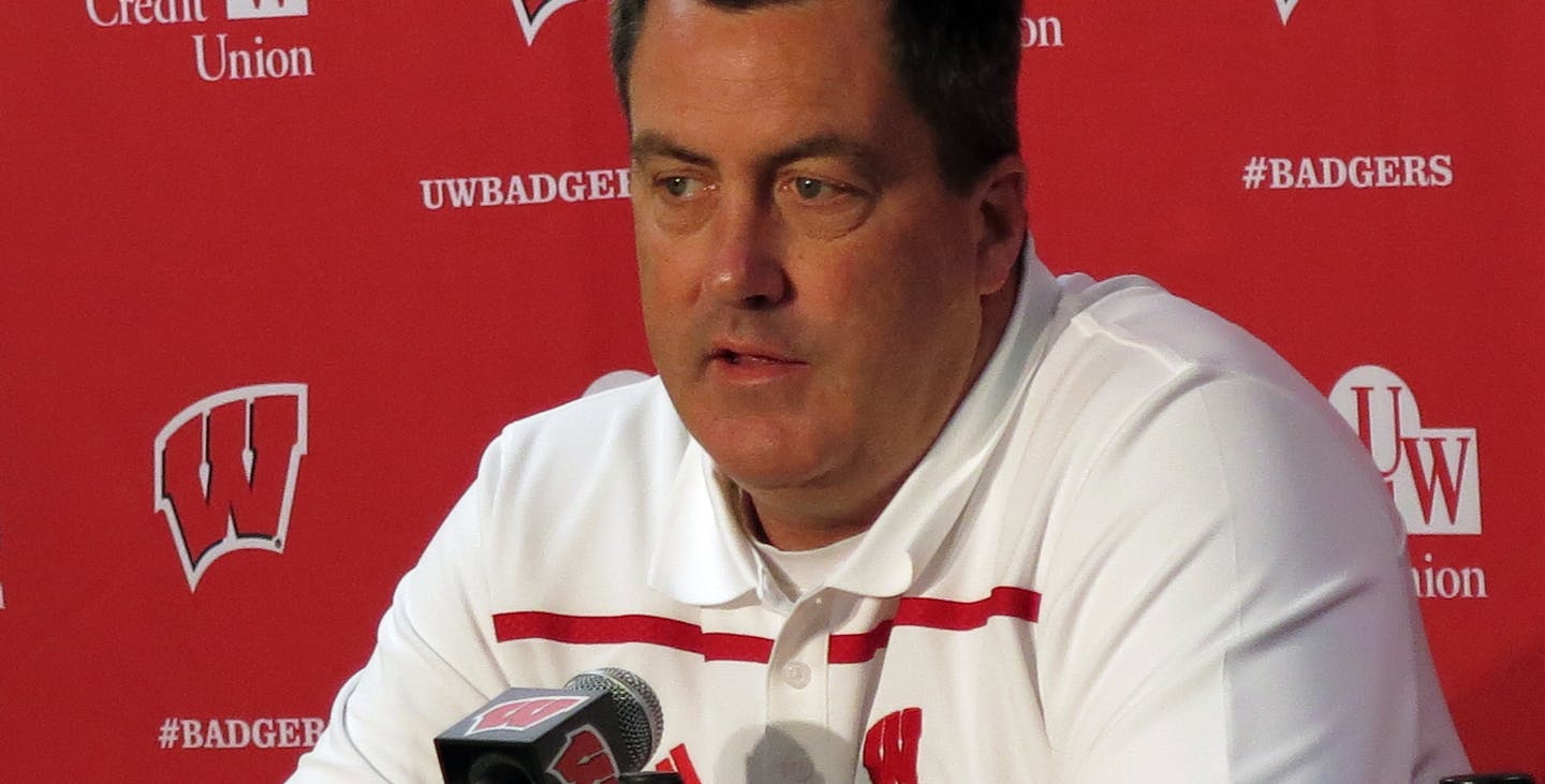 In this photo taken Sunday, Aug. 9, 2015, Wisconsin coach Paul Chryst answers a question during NCAA college football media day at Camp Randall Stadium in Madison, Wis. The former Badgers offensive coordinator is entering his first season as head coach at Wisconsin following three years at Pittsburgh. (AP Photo/Genaro C. Armas)