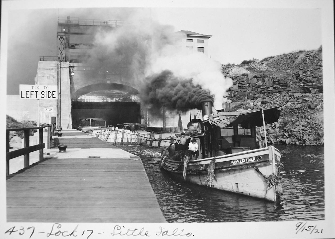 The tugboat "Geo E Lattimer" departs Lock E17 with a tow in September 1921. (New York State Archives, Albany)