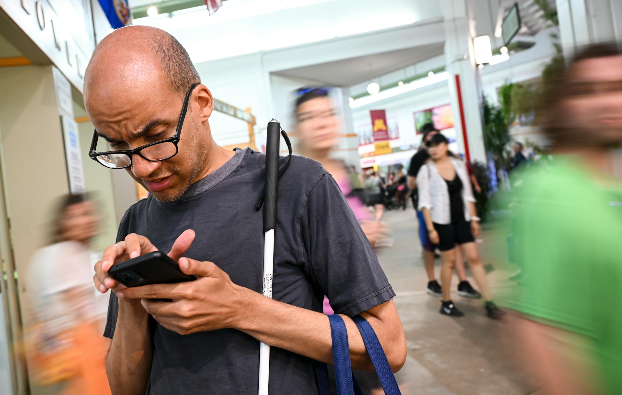 Paivy Ballayan, of Roseville, who was born blind, struggles a bit while using a combination of apps, including Google Maps and Lazarillo, to navigate the fair. Phones frequently have bad or no service at the fair, and that complicates navigation efforts for visually impaired people.