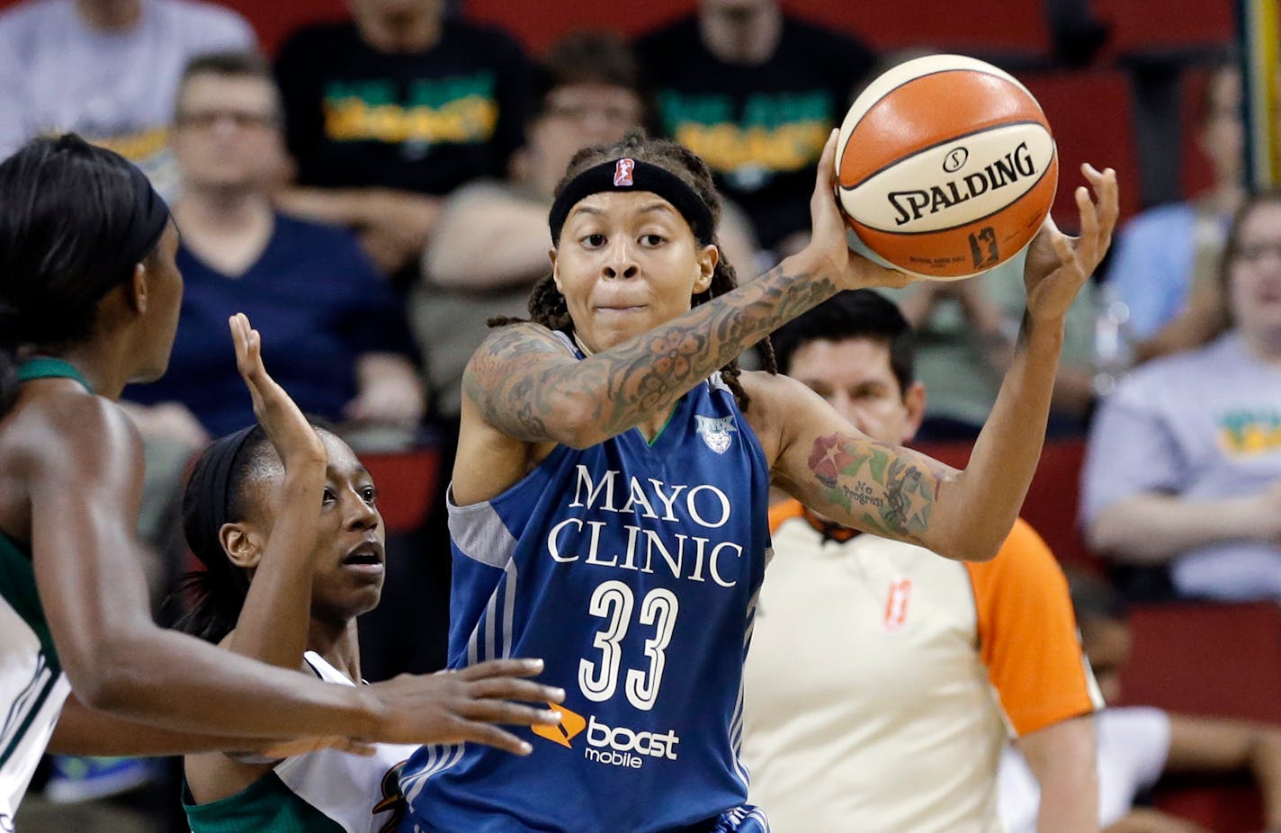 Minnesota Lynx's Seimone Augustus (33) looks for room to pass against the Seattle Storm during the second half of a WNBA basketball game Thursday, June 25, 2015, in Seattle. The Lynx won 76-73. (AP Photo/Elaine Thompson) ORG XMIT: MIN2015070219320278