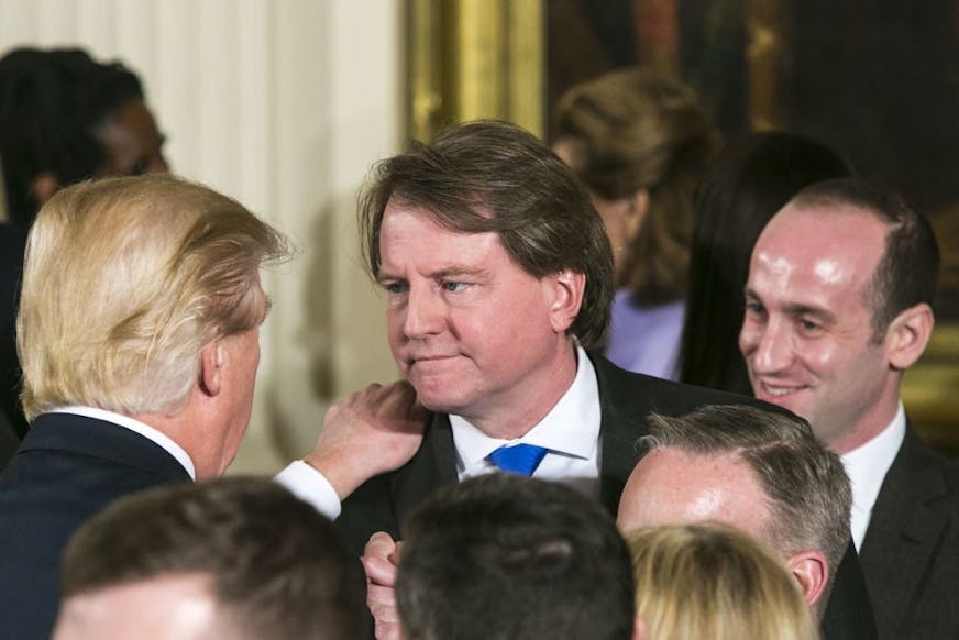 FILE - Don McGahn, the White House counsel, with President Donald Trump and Stephen Miller, right, a senior adviser, during a swearing-in ceremony in the East Room of the White House in Washington, Jan. 22, 2017.