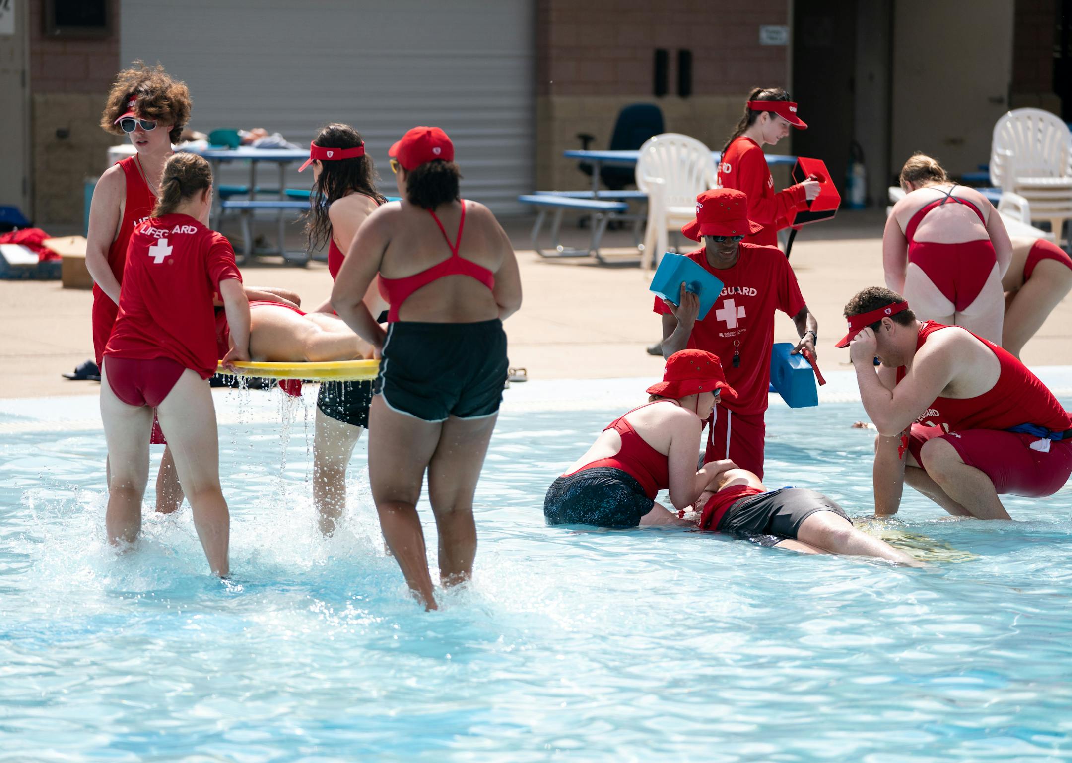 Lifeguards-in-training participate in a rescue exercise during a training program for new Ramsey County lifeguards.