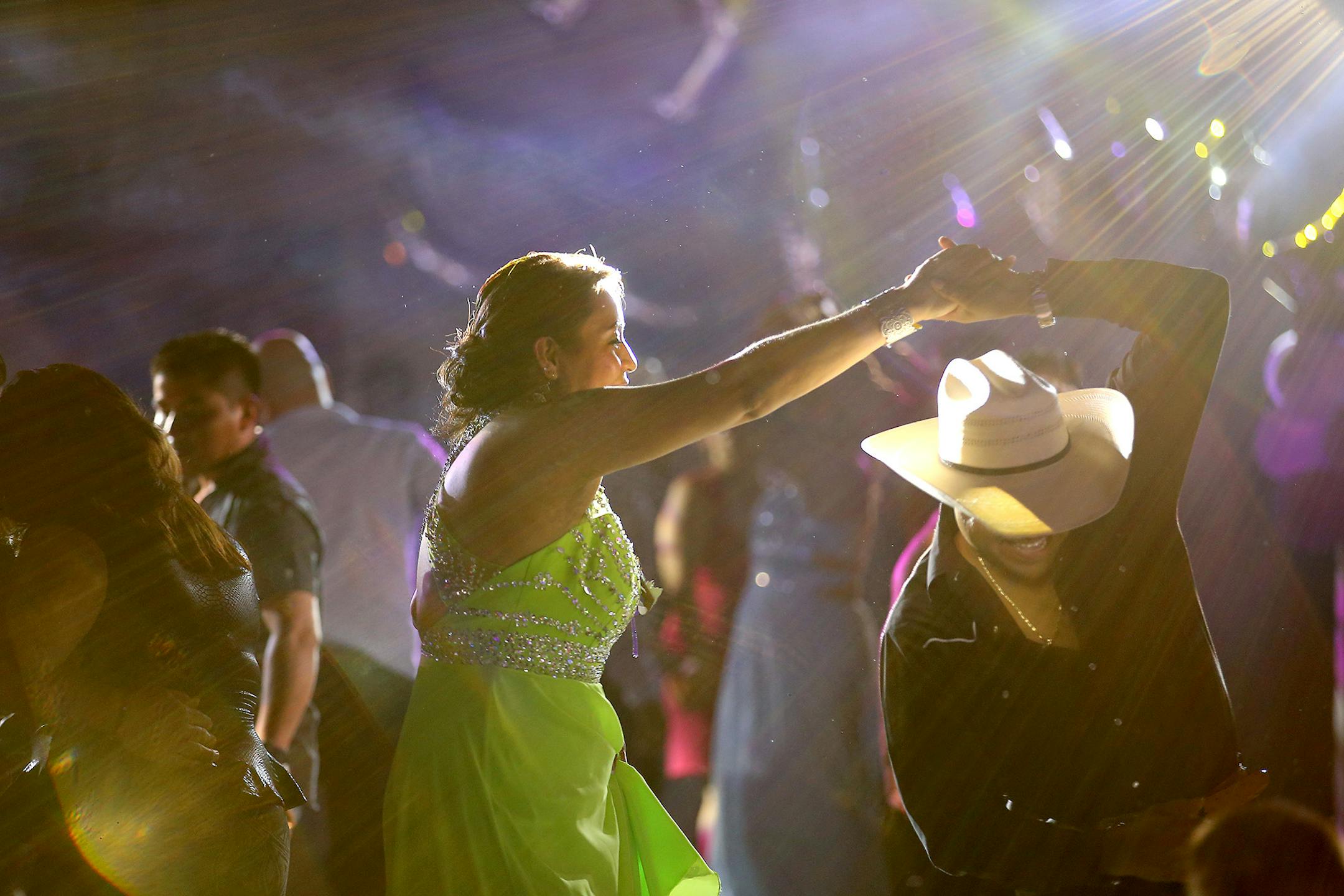 The night glittered with music and dancing as Patricia Omaña and other guests took to the floor to celebrate her daughter's coming-of-age party on a recent Saturday night.
