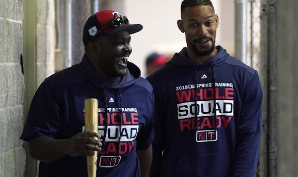 Minnesota Twins hitting coach James Rowson (82) joked with center fielder Byron Buxton (25) as they made their way to the batting cages Monday. ] ANTH