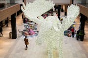 Shoppers walked past a large Moose made out of Christmas lights during the holiday season in 2019 at Rosedale Center. (RENEE JONES SCHNEIDER/renee.jon