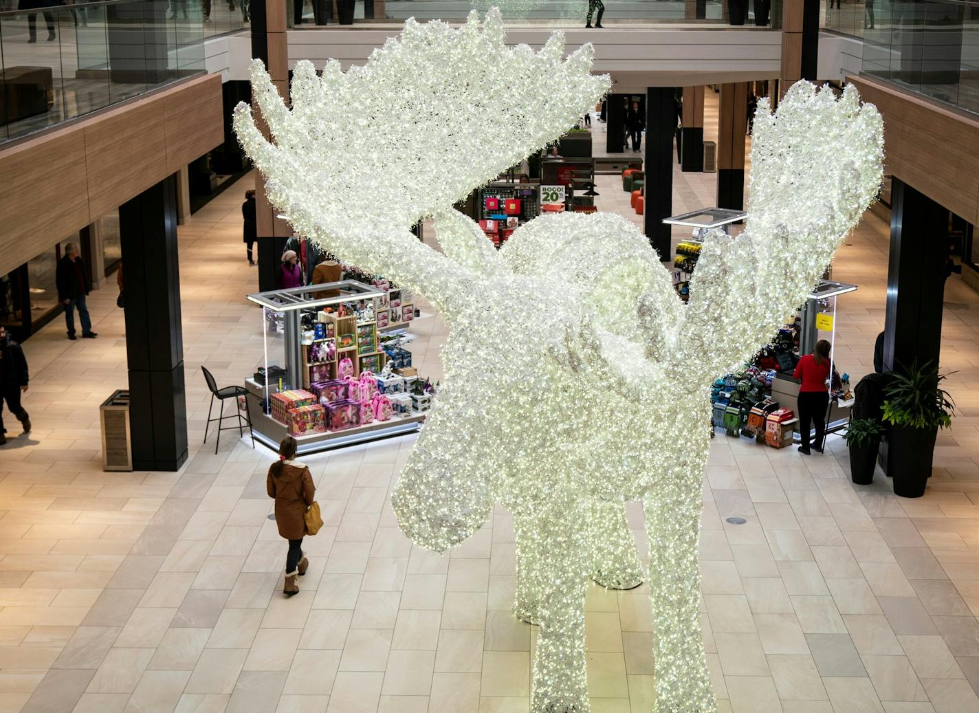 Shoppers walked past a large Moose made out of Christmas lights during the holiday season in 2019 at Rosedale Center. (RENEE JONES SCHNEIDER/renee.jones@startribune.com)