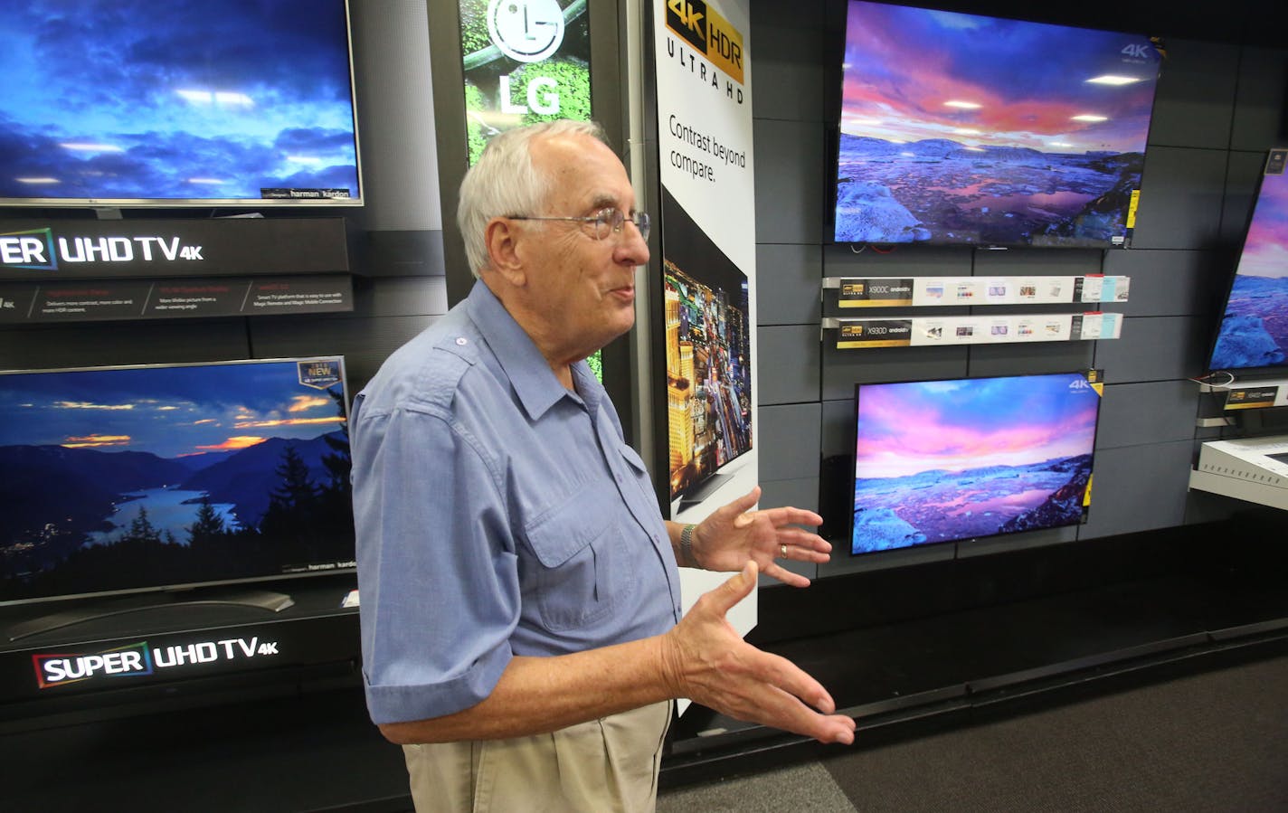 Woody Nelson of Andover got sidetracked in the TV section while admiring the size and clarity of new TVs as he made his way through store a Best Buy store Tuesday, Aug. 23, 2016, in Eden Prairie, MN.](DAVID JOLES/STARTRIBUNE)djoles@startribune Second quarter earnings reports were in Tuesday and Best Buy exceeded expectations.**Woody Nelson,cq