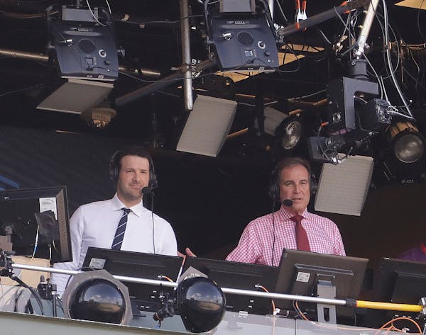Tony Romo and Jim Nantz are seen in the broadcast boothnbefore an NFL football game between the Green Bay Packers and the Cincinnati Bengals Sunday, S