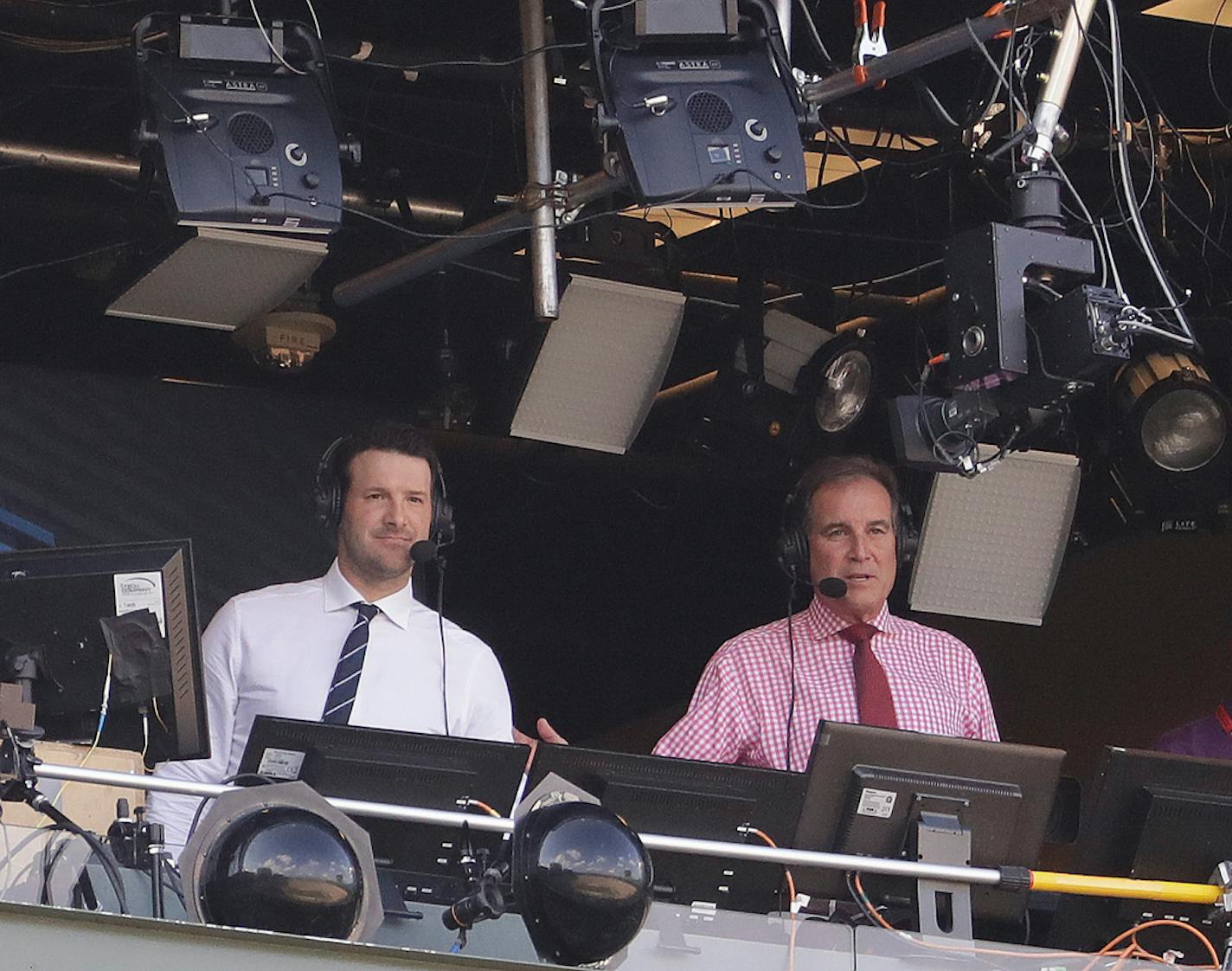 Tony Romo and Jim Nantz are seen in the broadcast boothnbefore an NFL football game between the Green Bay Packers and the Cincinnati Bengals Sunday, Sept. 24, 2017, in Green Bay, Wis. (AP Photo/Morry Gash) ORG XMIT: WIMG114