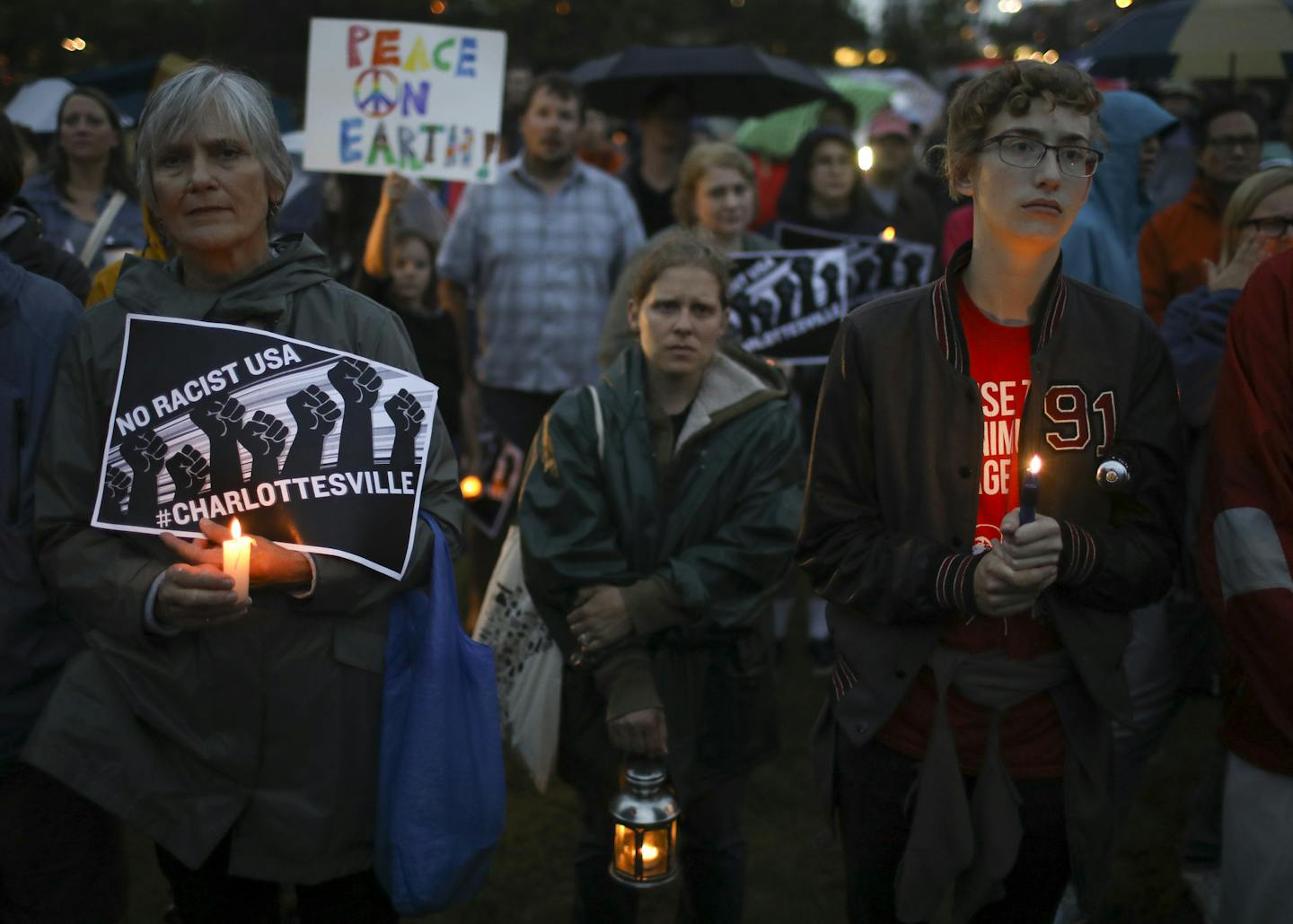 People attending the vigil Sunday night near Lake Calhoun listened to the speakers. ] JEFF WHEELER &#xef; jeff.wheeler@startribune.com Several hundred people attended a vigil held Sunday evening, August 13, 2017 at Lake Calhoun in response to the events Saturday in Charlottesville, Virginia.