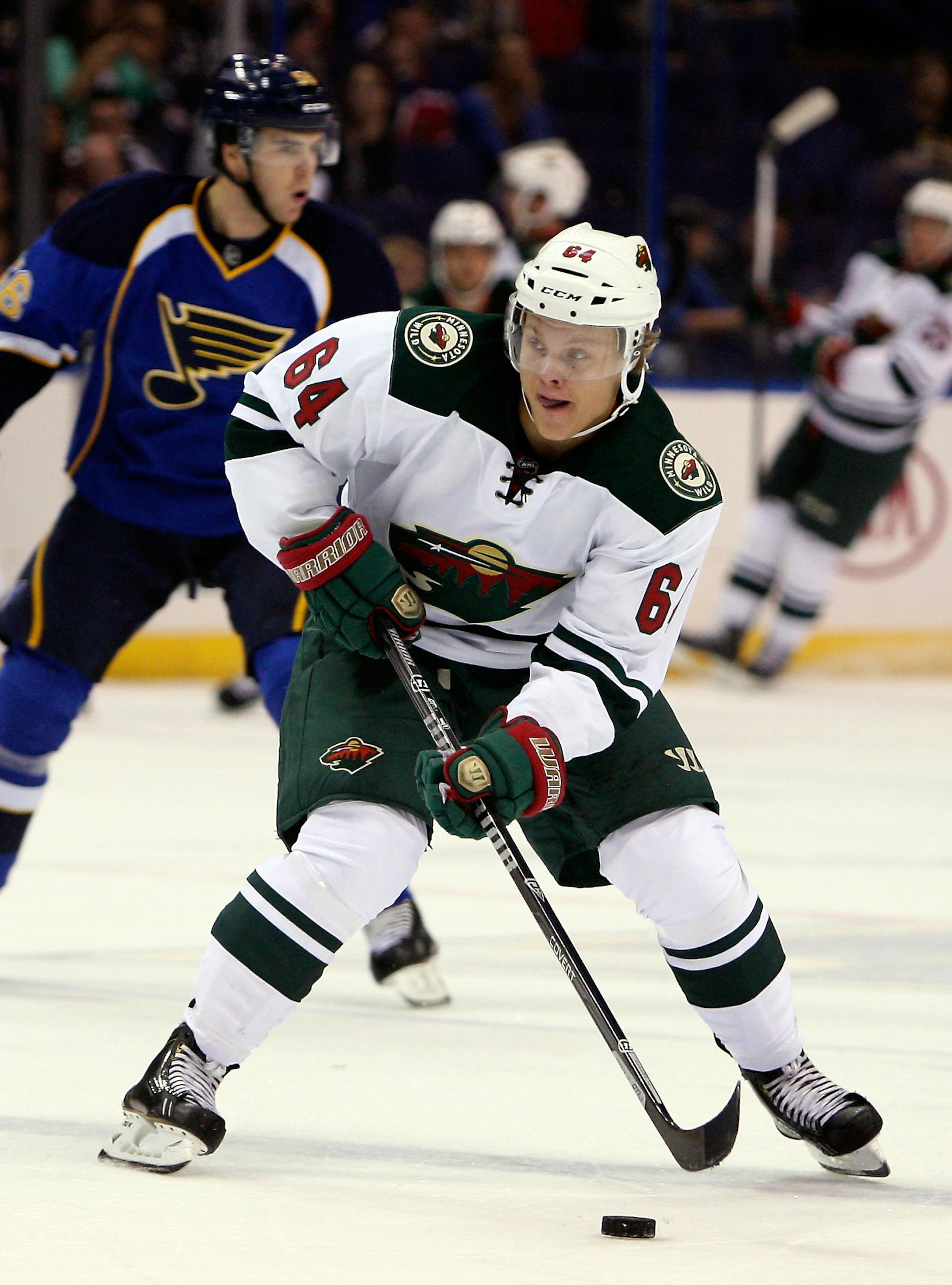 Minnesota Wild's Mikael Granlund, of Finland, looks to pass the puck during the first period of a preseason NHL hockey game against the St. Louis Blues Friday, Sept. 27, 2013, in St. Louis. (AP Photo/Scott Kane)