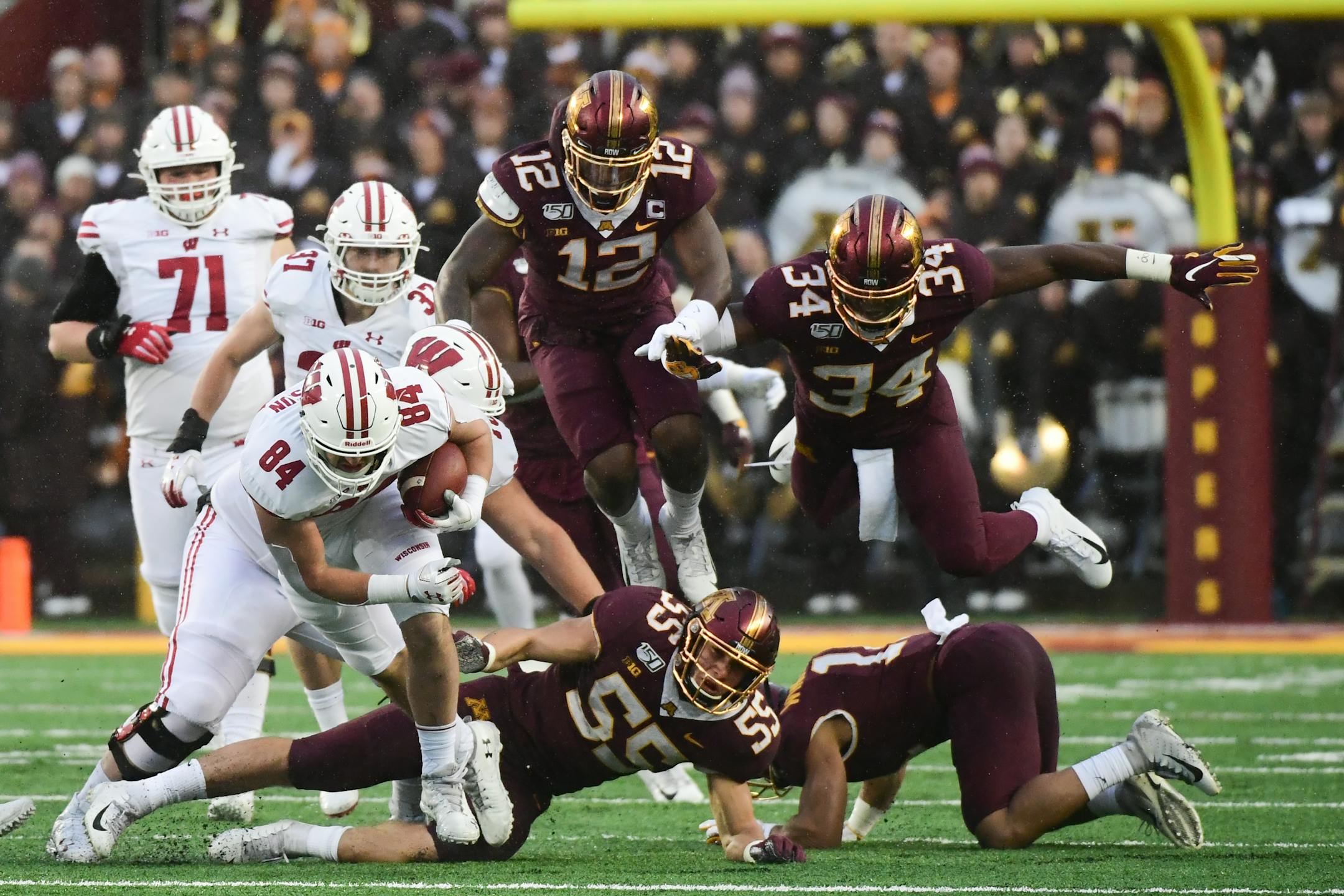 After Wisconsin beat Minnesota 38-17 on Saturday, the Badgers jumped up four spots in the College Football Playoff rankings to No. 8 and the Gophers fell from No. 8 to 18.