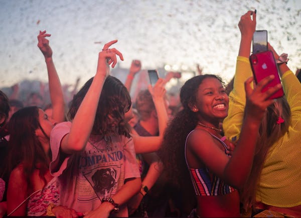 The crowd reacted to a blast of confetti early in Tame Impala's set at Surly Festival Field.