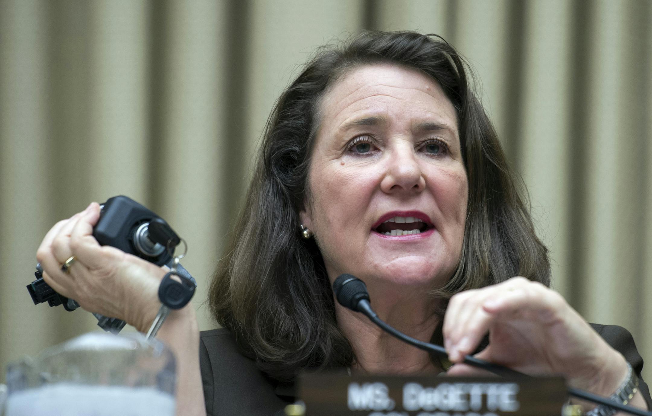 The House Oversight and Investigations subcommittee ranking member, Rep. Diana DeGette, D-Colo. holds an automobile ignition switch as she addresses General Motors CEO Mary Barra and former US Attorney Anton Valukas, investigator , Jenner & Block, as they testify on Capitol Hill in Washington, Wednesday, June 18, 2014, before the subcommittee's hearing examining the facts and circumstances that contributed to General Motors’ failure to identify a safety defect in certain ignition switches