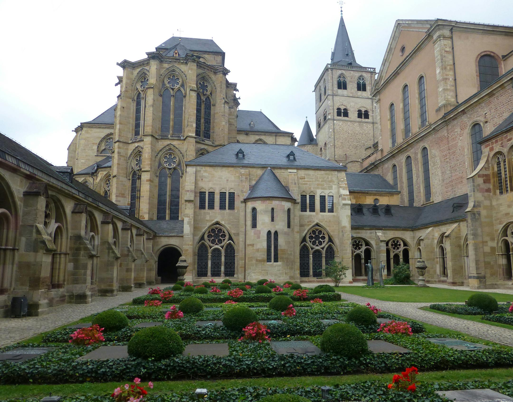 A cloister, now a garden, links the 11th-century Romanesque cathedral to the 13th-century Liebfrauenkirche (Church of Our Lady) in Trier, Germany.