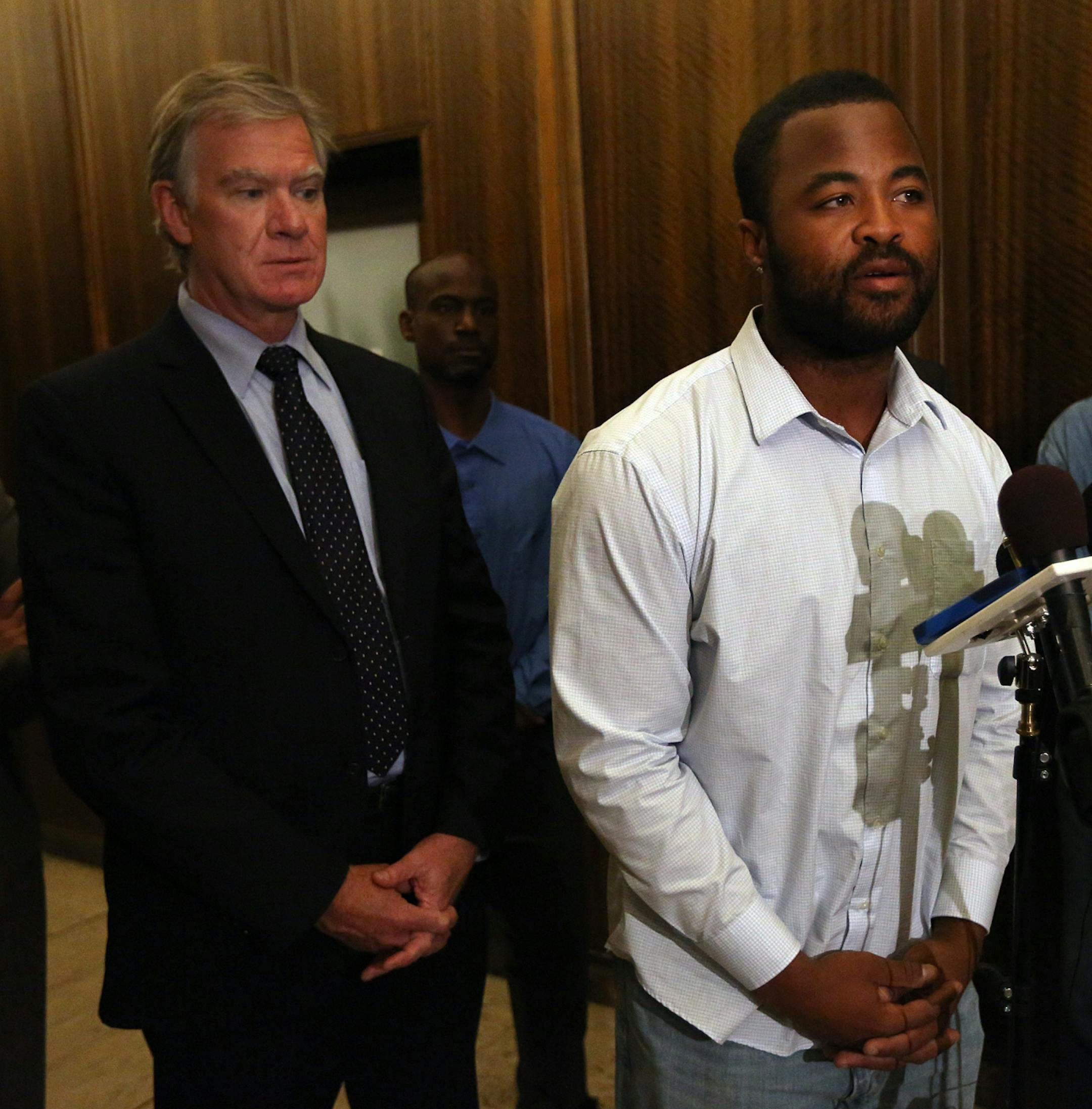 Rashad Turner, the leader of the St. Paul Black Lives Matter group (at mic stand), St. Paul Mayor Chris Coleman (middle) and Saint Paul Deputy Mayor, Kristin Beckmann appeared before members of the media following a meeting Thursday morning at the Mayor�s office.
