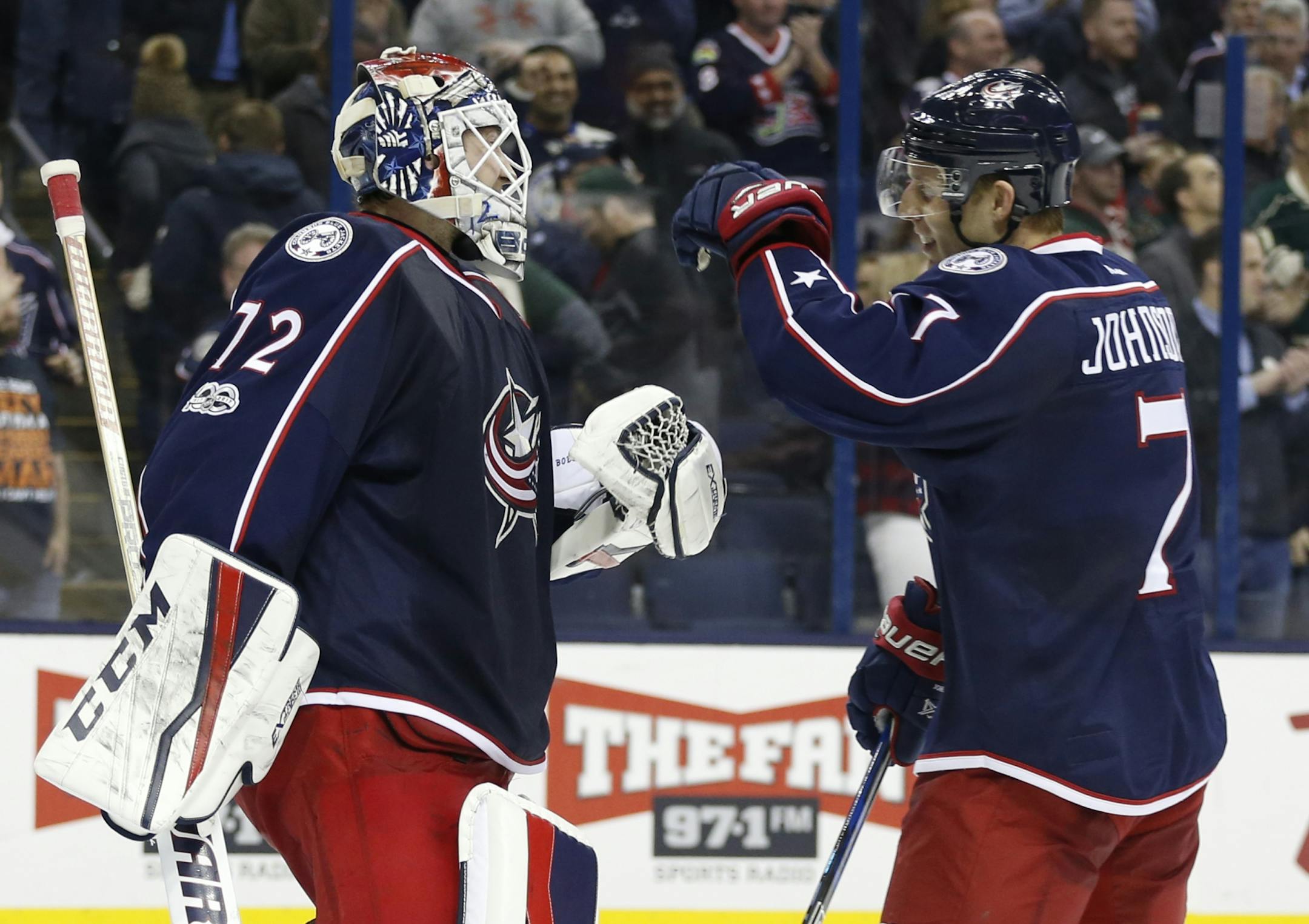 Columbus Blue Jackets' Sergei Bobrovsky, left, of Russia, celebrates with Jack Johnson after the team's 1-0 win over the Minnesota Wild in an NHL hockey game Thursday, March 2, 2017, in Columbus, Ohio.