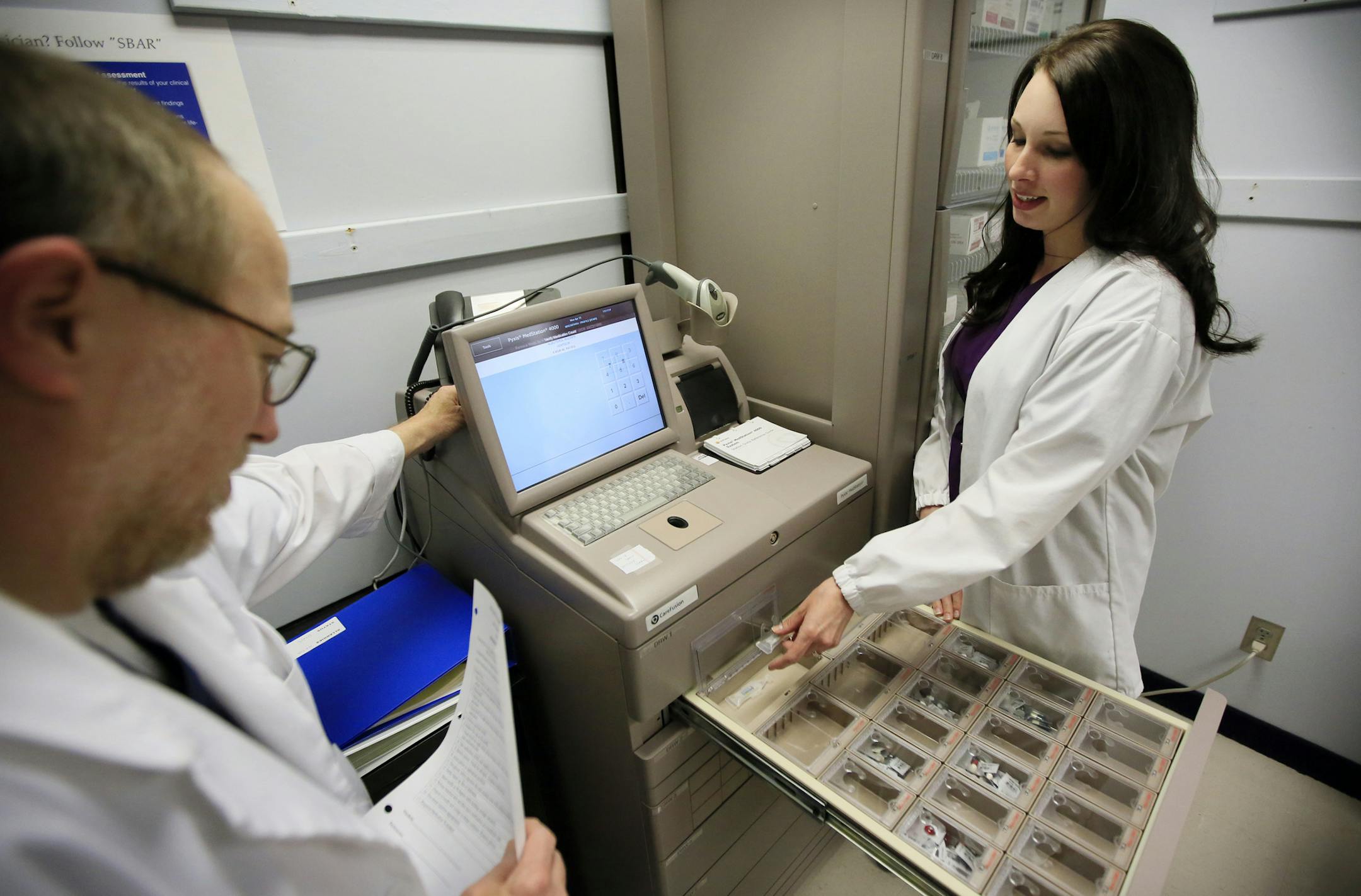 Pharmacology students at Dakota County Technical College, Mike Martin and Jessica Nelson are now training with the MedStation4000, a medication dispensing system used at hospitals. ] BRIAN PETERSON ‚Ä¢ brianp@startribune.com Rosemount, MN - 04/15/2013 ORG XMIT: MIN1304171347491255
