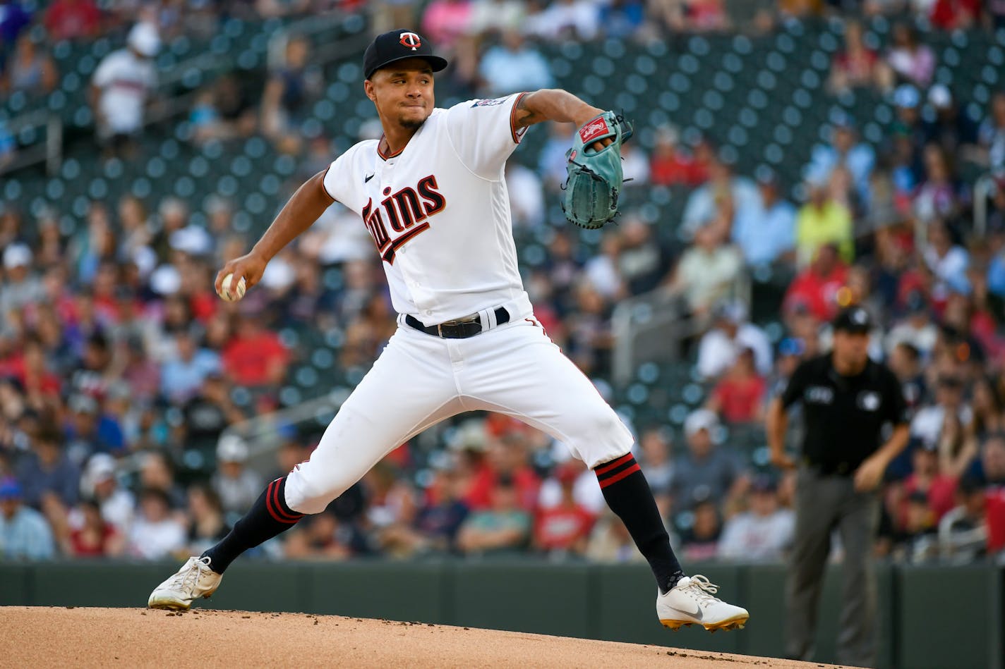 Twins pitcher Chris Archer throws against the Colorado Rockies during the first inning Saturday