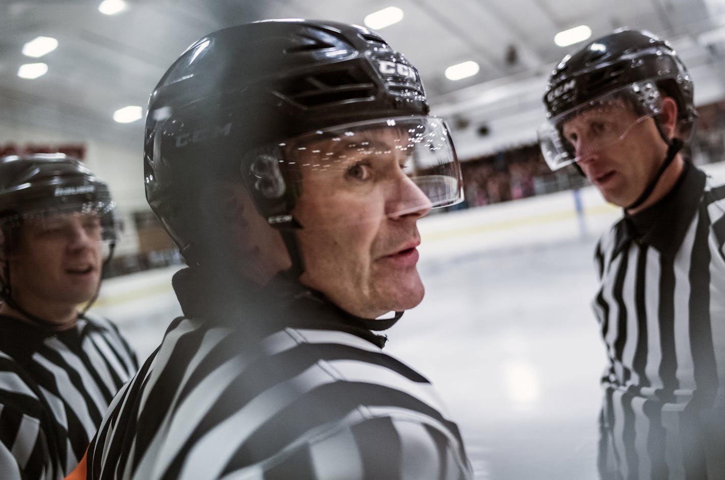 C.J. Beaurline,center, has over 20 years of experience as an official. He also works Gophers' hockey games on the weekend. On the left is linesman David Berthiaume and on the far right is Joe Harris.] rep data project on where penalty numbers stand 6 1/2 seasons since an illegal hit fell Jack Jablonski. Officiating crew, led by C.J. Beaurline. We're looking for behind-the-scenes plus game action interaction in a home game between Centennial and Duluth East. RICHARD TSONG-TAATARII &#xa5; richard.