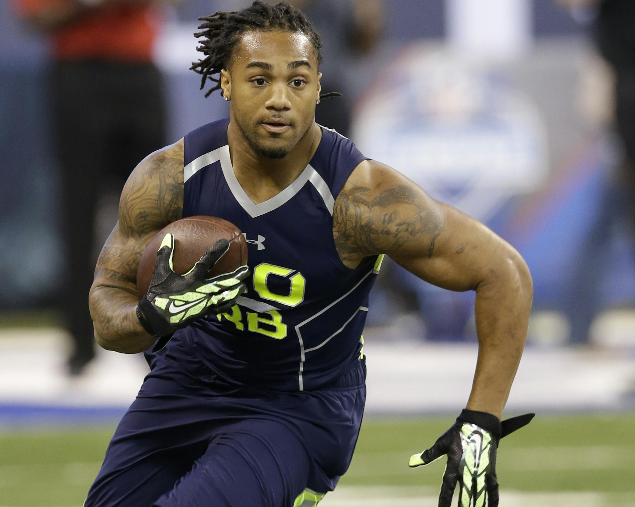 Auburn running back Tre Mason runs a drill at the NFL football scouting combine in Indianapolis, Sunday, Feb. 23, 2014. (AP Photo/Nam Y. Huh) ORG XMIT: NYOTK