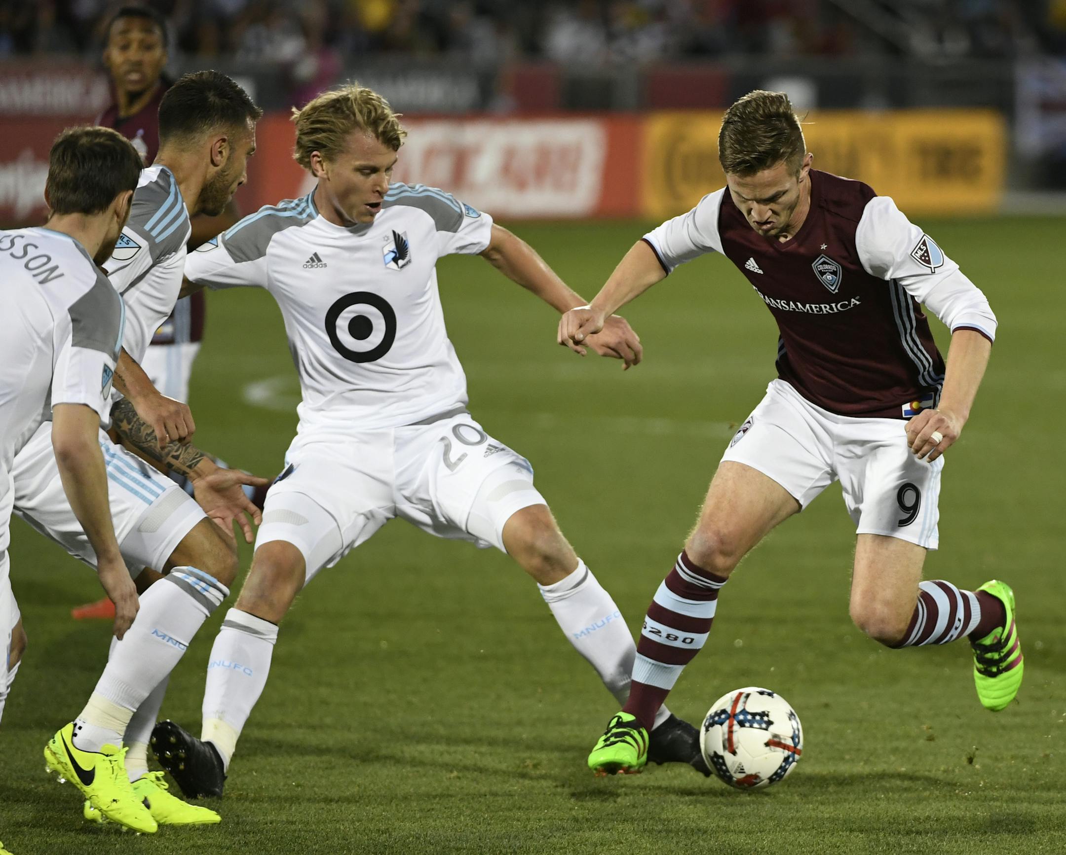 United midfielder Rasmus Schuller (20) made tighter defense a priority against forward Kevin Doyle and the Colorado Rapids.