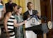 President Barack Obama is presented a Minnesota Lynx team basketball jersey by players Lindsay Whalen, center, and Maya Moore, left, during a ceremony