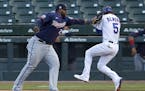 Minnesota Twins first baseman Miguel Sano tags out Chicago Cubs' Albert Almora Jr. during the fourth inning of a summer camp baseball game Wednesday, 