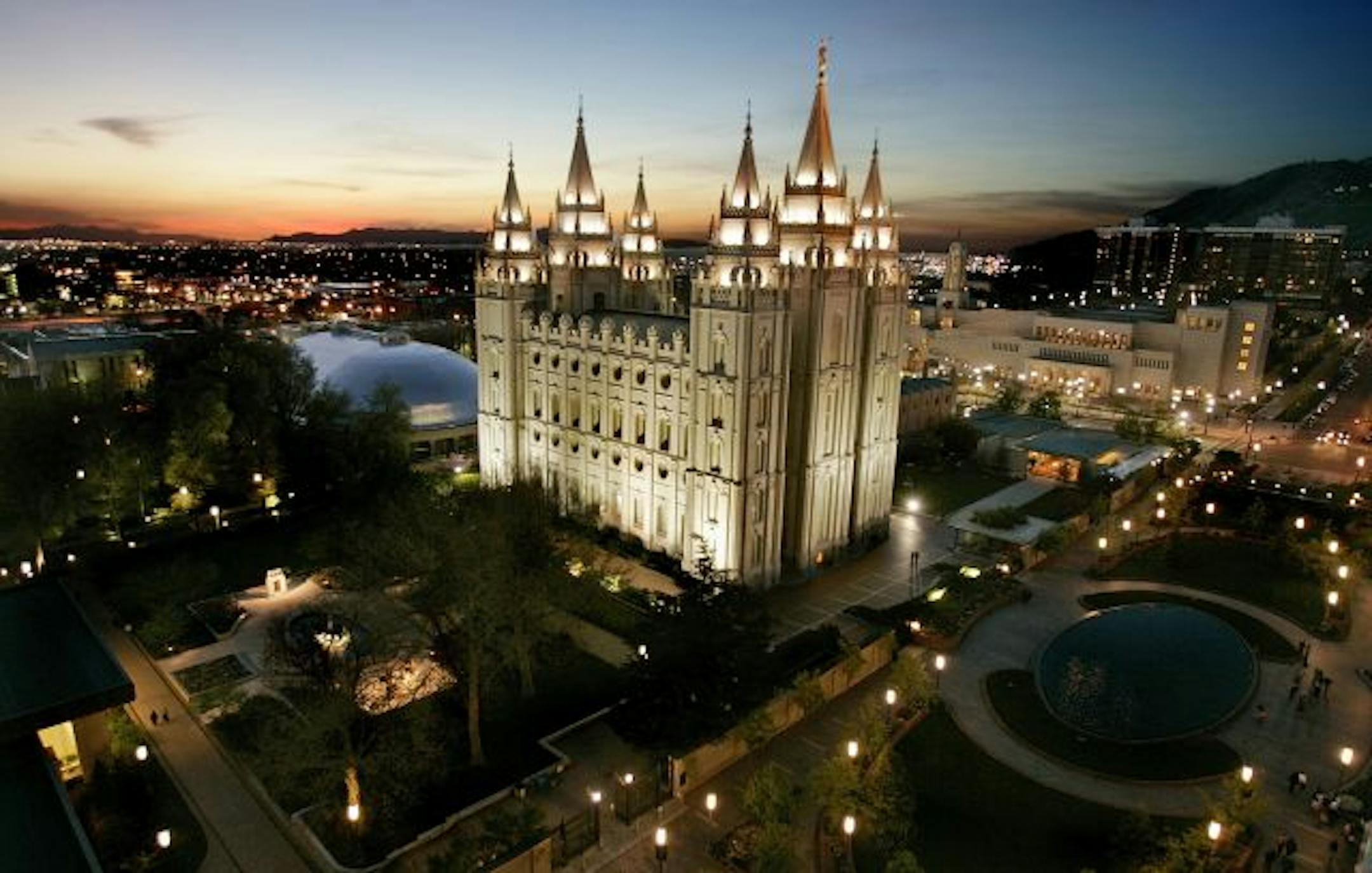 The sun sets behind the Mormon Temple in Salt Lake City, Utah.