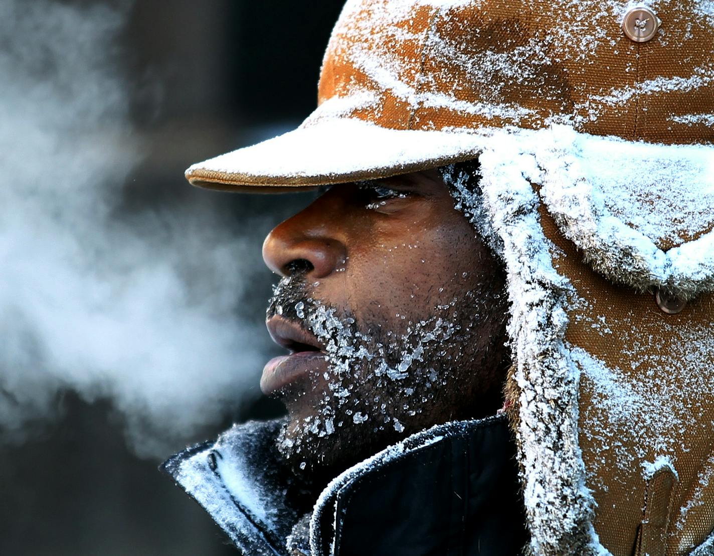 jgholt@startribune.com Minneapolis, MN 12/12/2010 Jerry Holt----Minneapolis digs out day after big snow strom. .IN THIS PHOTO ] James Benson braved to cold weather as he cleared of the sidewalk in downtown Minneapolis on Sunday morning.