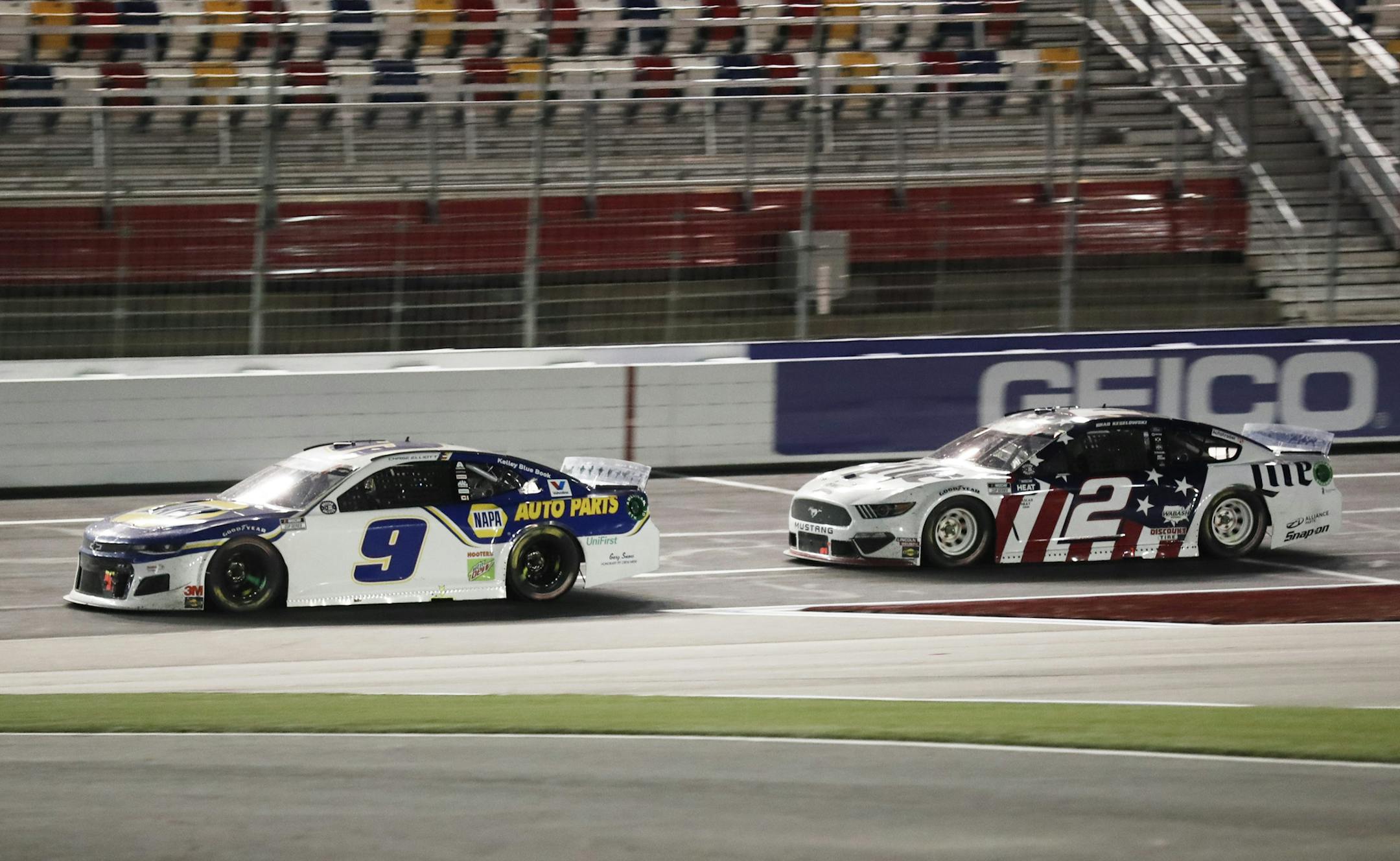 Chase Elliott (9) leads Brad Keselowski (2) during a NASCAR Cup Series auto race at Charlotte Motor Speedway Sunday, May 24, 2020, in Concord, N.C. (AP Photo/Gerry Broome)
