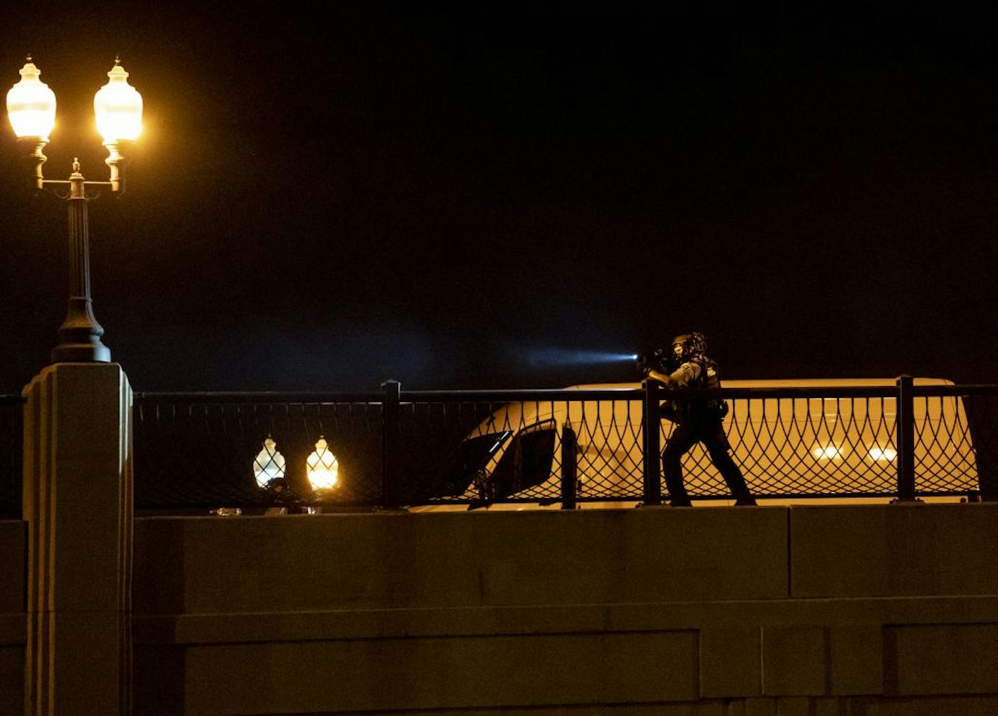 Polce shot smoke and tear gas at protesters on Lake Street at Hiawatha in Minneapolis, Minn., on Saturday, May 30, 2020.