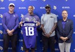 Mark Wilf, right, joined Vikings coach Kevin O'Connell, left, Justin Jefferson and General Manager Kwesi Adofo-Mensah on stage Tuesday in Eagan after 