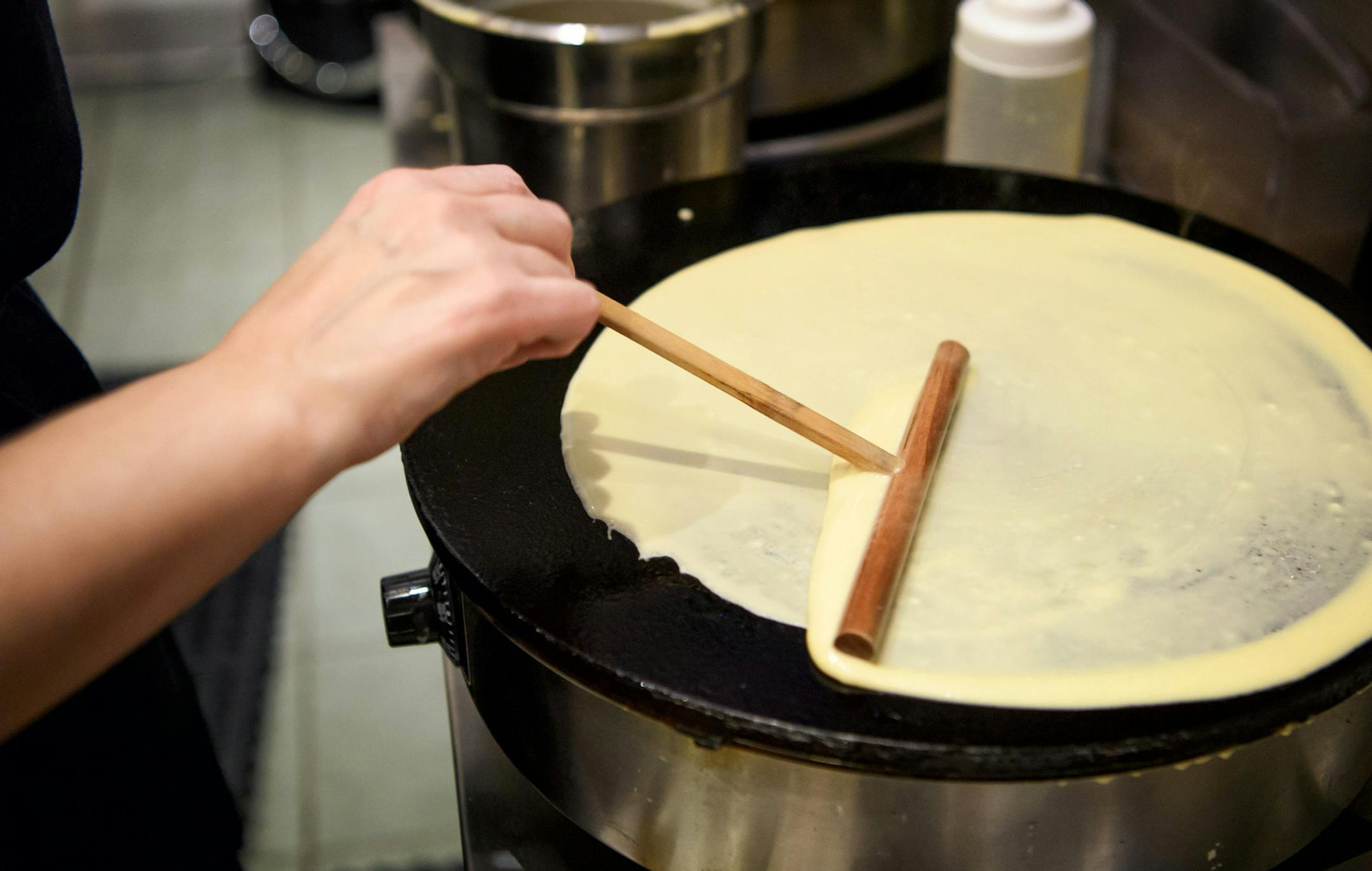 Owner and former student Oksana Goldenstein busily made fresh crepes for the thirty students and staff from her former school. ] GLEN STUBBE * gstubbe@startribune.com Wednesday, November 23, 2016 Former adult English as a Second Language student, Oksana Goldenstein, has opened a crepe shop downtown. She has invited her former Anoka-Hennepin classmates to come visit her shop. The classmates will take a field trip via Metro Transit bus to the crepe shop. On the ride, the English language learners
