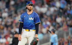 Twins starting pitcher Bailey Ober stands on the mound after a solo home run by the Blue Jays' George Springer during the sixth inning of Friday night