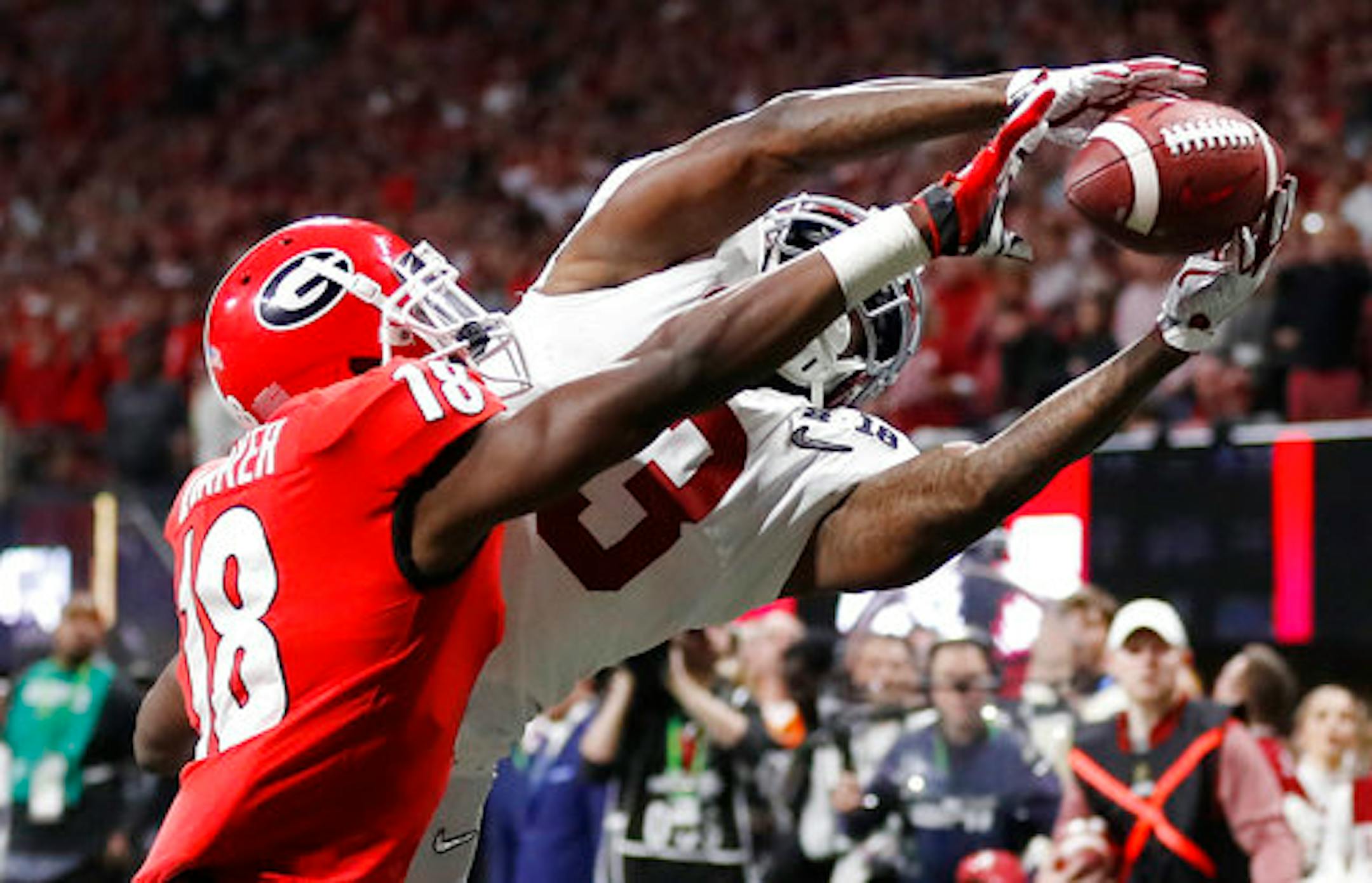 Georgia's Deandre Baker knocks the ball away from Alabama's Calvin Ridley during the second half of the NCAA college football playoff championship game Monday, Jan. 8, 2018, in Atlanta. (AP Photo/David Goldman)