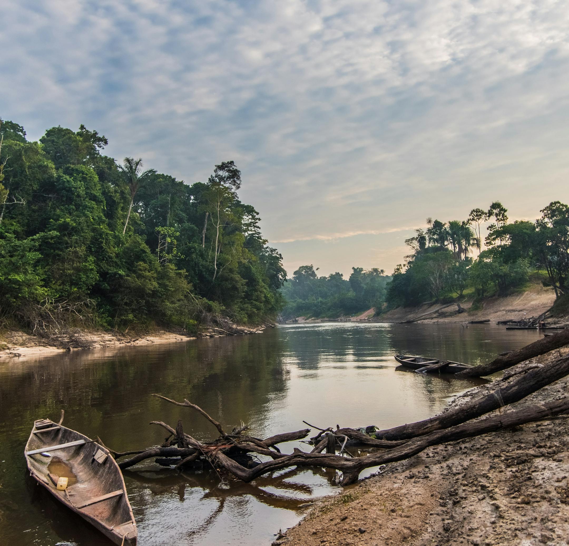 A handmade dugout canoe anchored in Buen Peru bobs on the Galvez River, a tributary of the waterway that serves as a natural 500-mile border between Peru and Brazil: The Javary River.