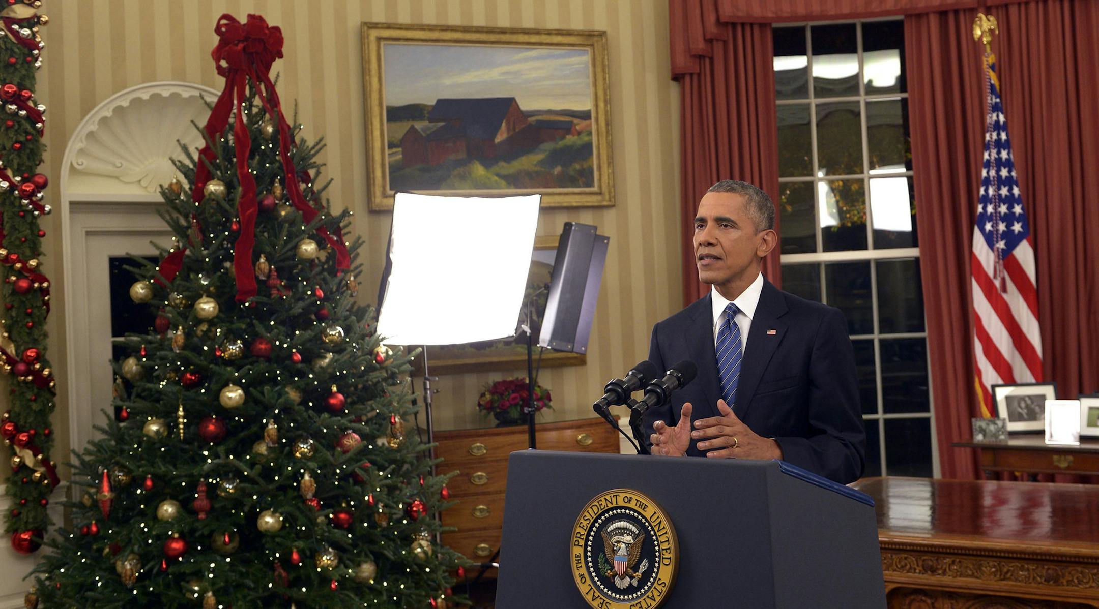 President Barack Obama addresses the nation from the Oval Office at the White House in Washington, Sunday night, Dec. 6, 2016. In a rare Oval Office address, Obama vowed the United States would overcome a terror threat that has entered a "new phase" as he sought to reassure Americans shaken by recent attacks in Paris and California. (Saul Loeb/Pool Photo via AP) ORG XMIT: MIN2015120713123025