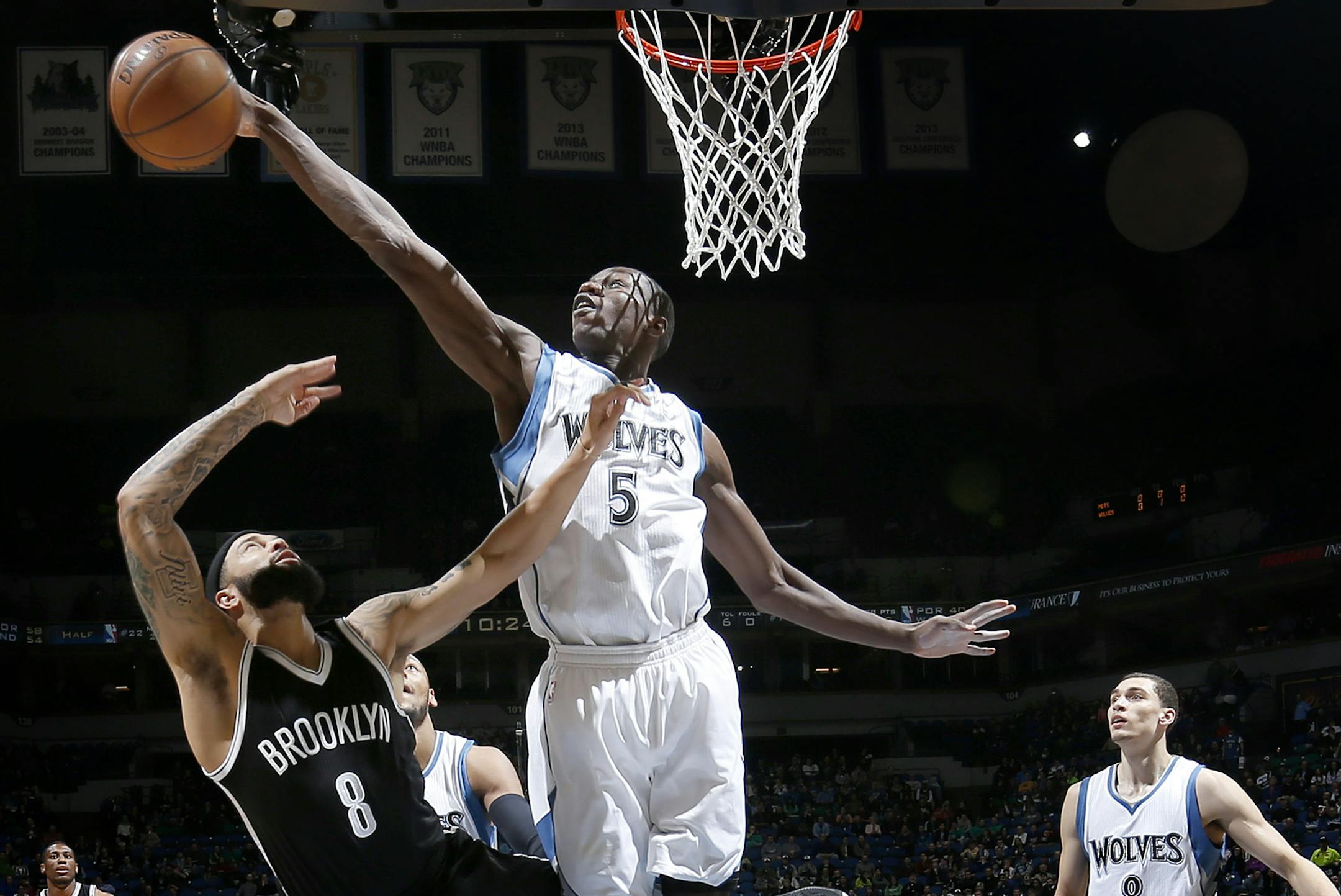 Gorgui Dieng (5) blocked a shot by Deron Williams (8) in the first quarter. ] CARLOS GONZALEZ cgonzalez@startribune.com, March 16, 2015, Minneapolis, Minn., 2015, NBA, Target Center, Minnesota Timberwolves vs. Brooklyn Nets ORG XMIT: MIN1503162128294645