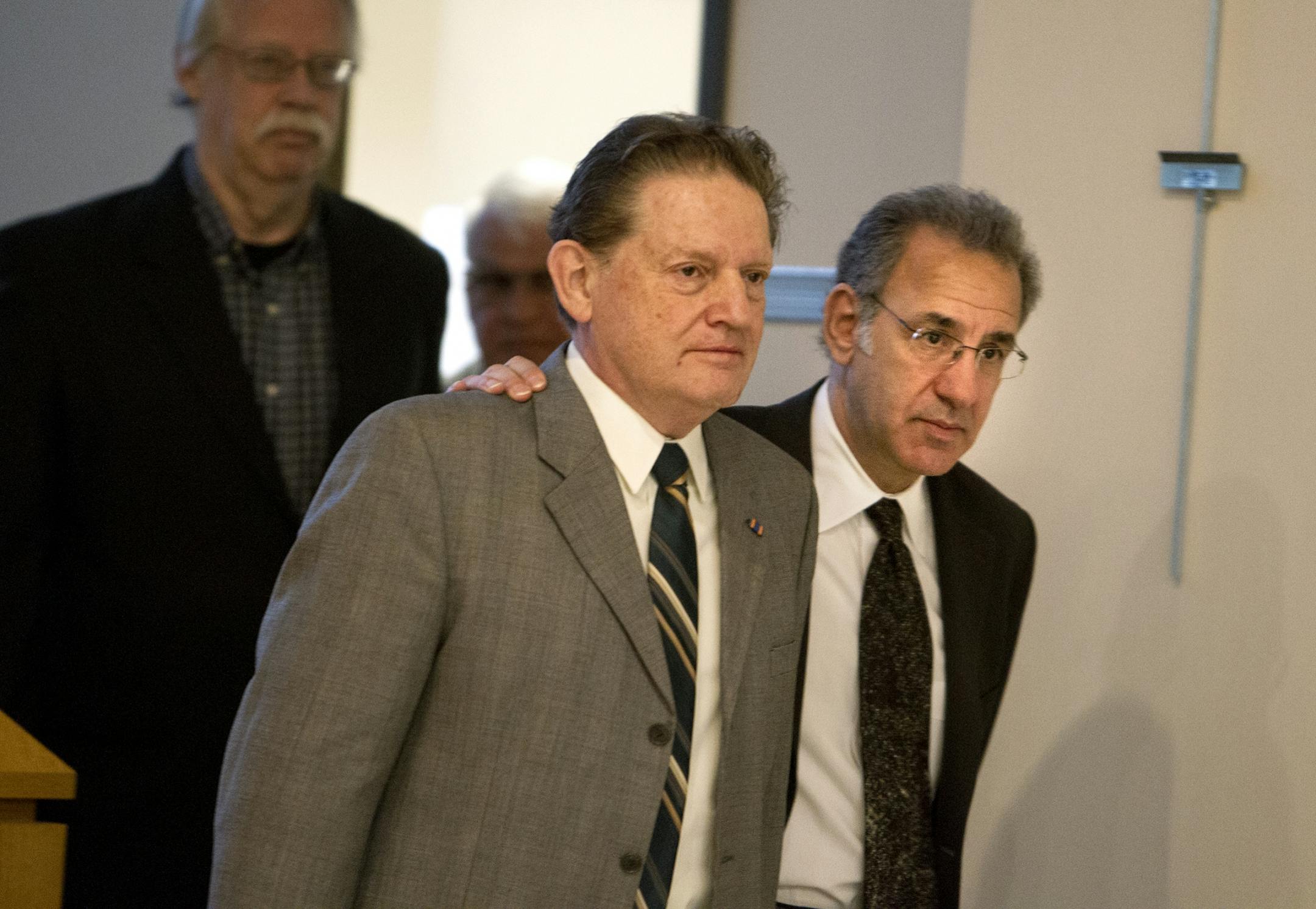 Attorney Steve Meshbesher, right, walks his client Byron Smith into the courtroom at the Morrison County Courthouse in Little Falls April 28, 2014.
