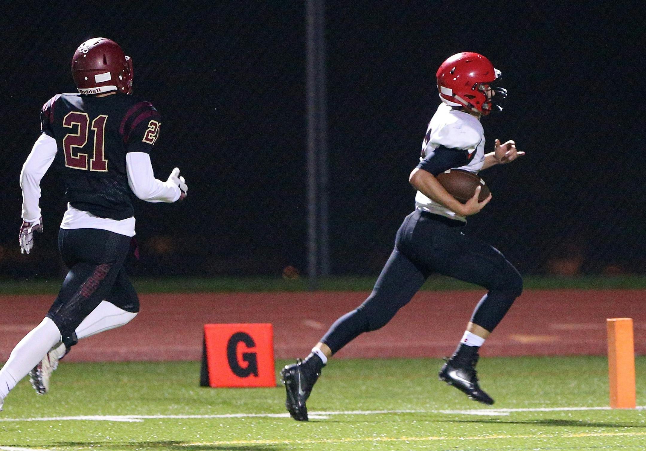 Eden Prairie quarterback Cole Kramer recovers a fumble and runs for 50 yards and a touchdown for the Eagles in their 28-15 victory over Maple Grove.