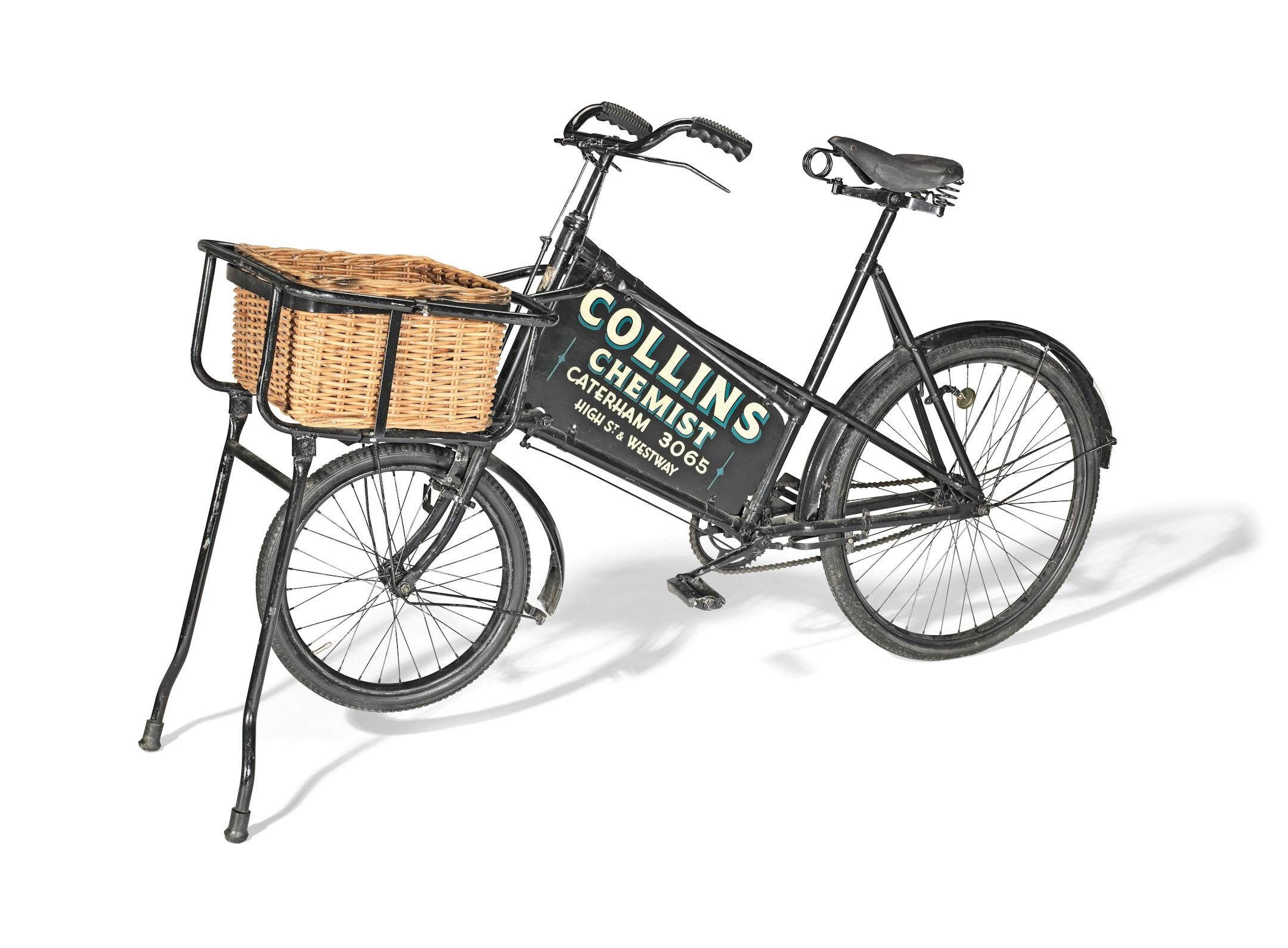Midcentury delivery bike for Collins Chemist with basket on front