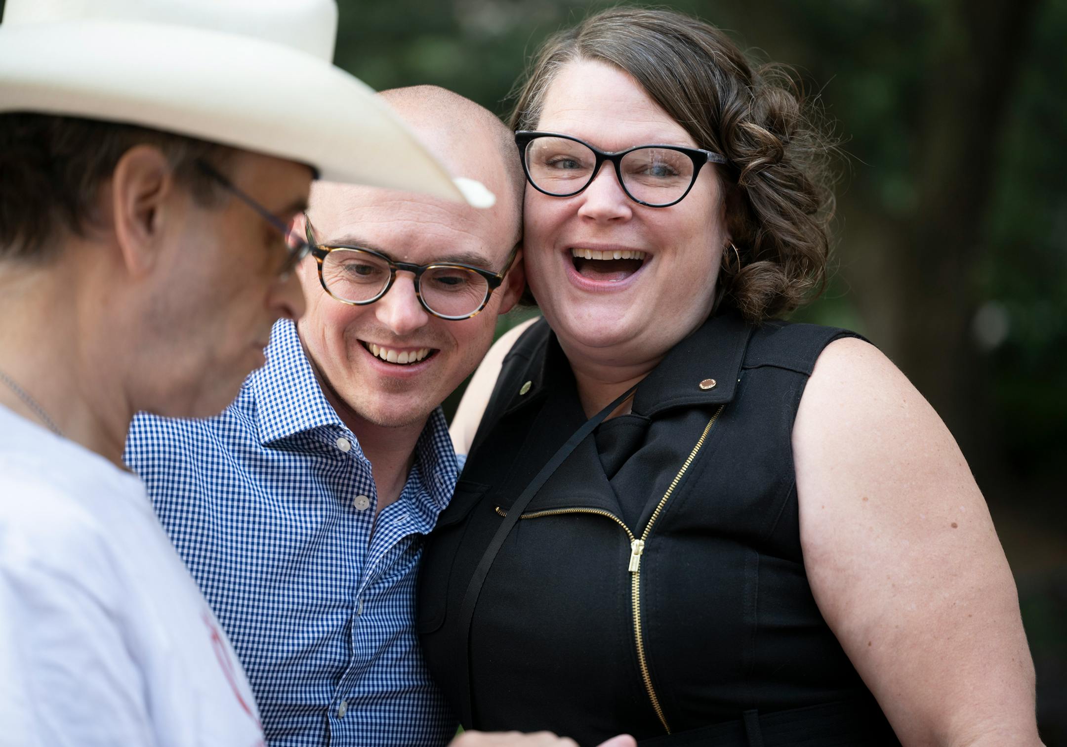 Courteney Ross, who was the girlfriend of George Floyd, and Minneapolis City Council candidate Soren Stevenson, who lost an eye after being shot by a less lethal round by Minneapolis Police during a protest after Floyd's murder, share an embrace before a rally outside the Hennepin County Government Center Friday, June 16, 2023, in Minneapolis, Minn. The US Department of Justice released the findings in its sweeping investigation into the Minneapolis Police Department finding it routinely engaged in a pattern of racist and abusive behavior.