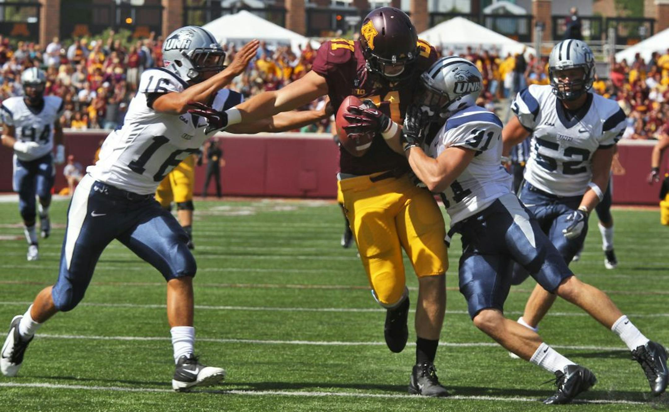 John Rabe rambled through Wildcats tacklers after catching a first half pass and carrying it to the five yard line setting up a Minnesota touchdown on the next play.