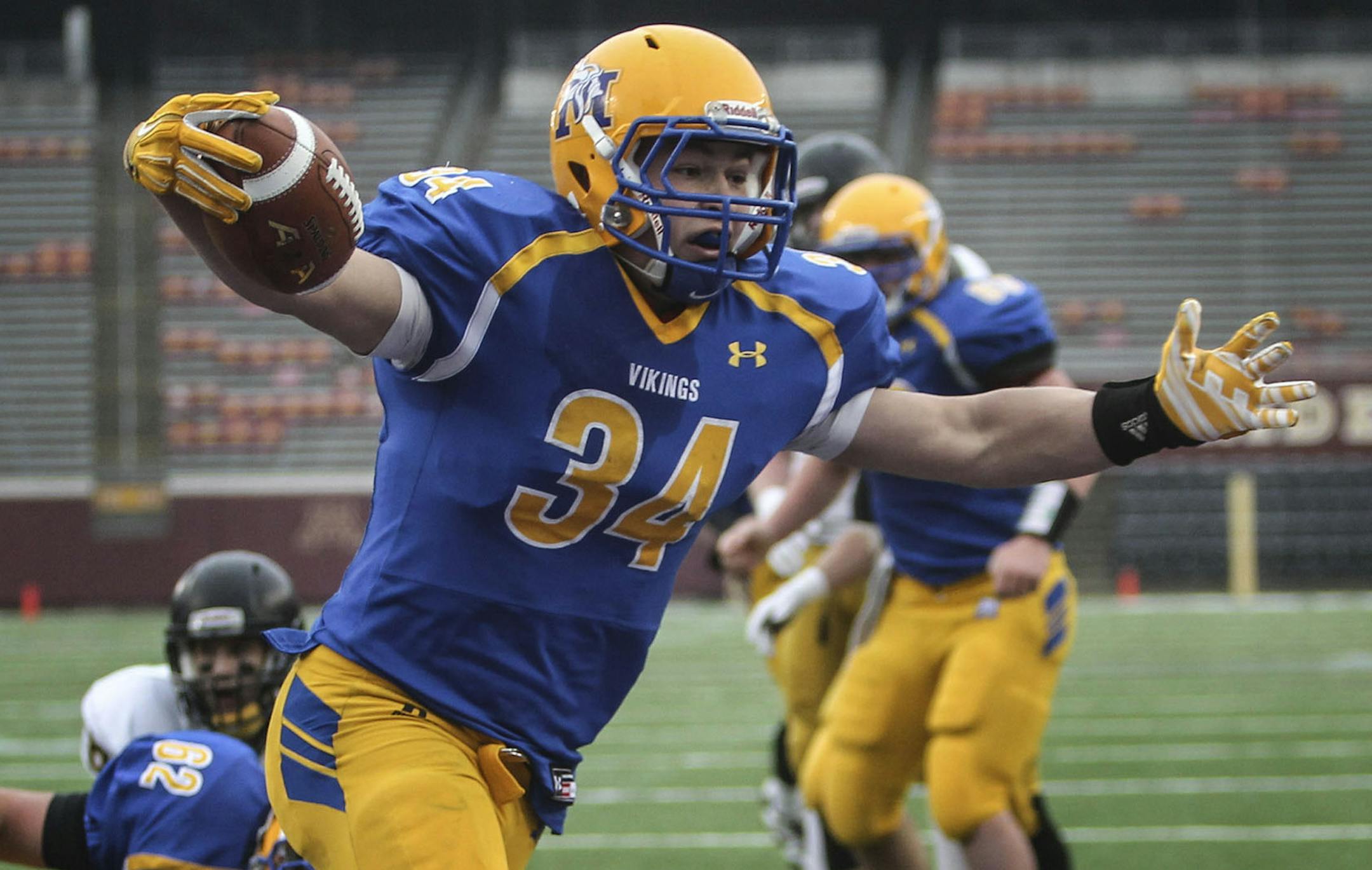 Minneota runningback Garrett Hennen (34) carries the ball into the endzone for a first quarter touchdown against Dawson-Boyd in the 1A Minnesota State High School League football championship Saturday, Nov. 22, 2014, at TCF Bank Stadium in Minneapolis, MN.](DAVID JOLES/STARTRIBUNE)djoles@startribune 1A Minnesota State High School League championship betweenDawson-Boyd vs. Minneota Saturday, Nov. 22, 2014, at TCF Bank Stadium in Minneapolis, MN.**Garrett Hennen ,cq