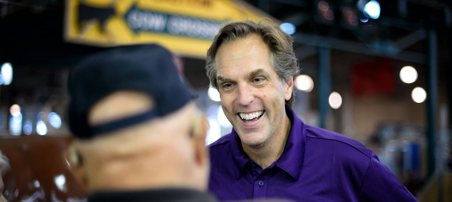 GOP Senate candidate Mike McFadden laughed with Larry and Evy Walters of Brooklyn Park in the State Fair Cattle Barn. Larry Walters then asked if he could see son Connor's scar from where Mike removed the stitches, featured in his current Television ad. ] Falcon Heights , MN -- Thursday, August 28, 2014. GLEN STUBBE * gstubbe@startribune.com