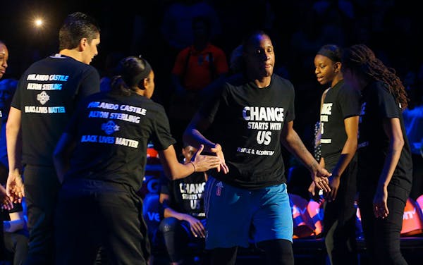 Minnesota Lynx forward Rebekkah Brunson (32) walks out to the court as starting lineups are announced.