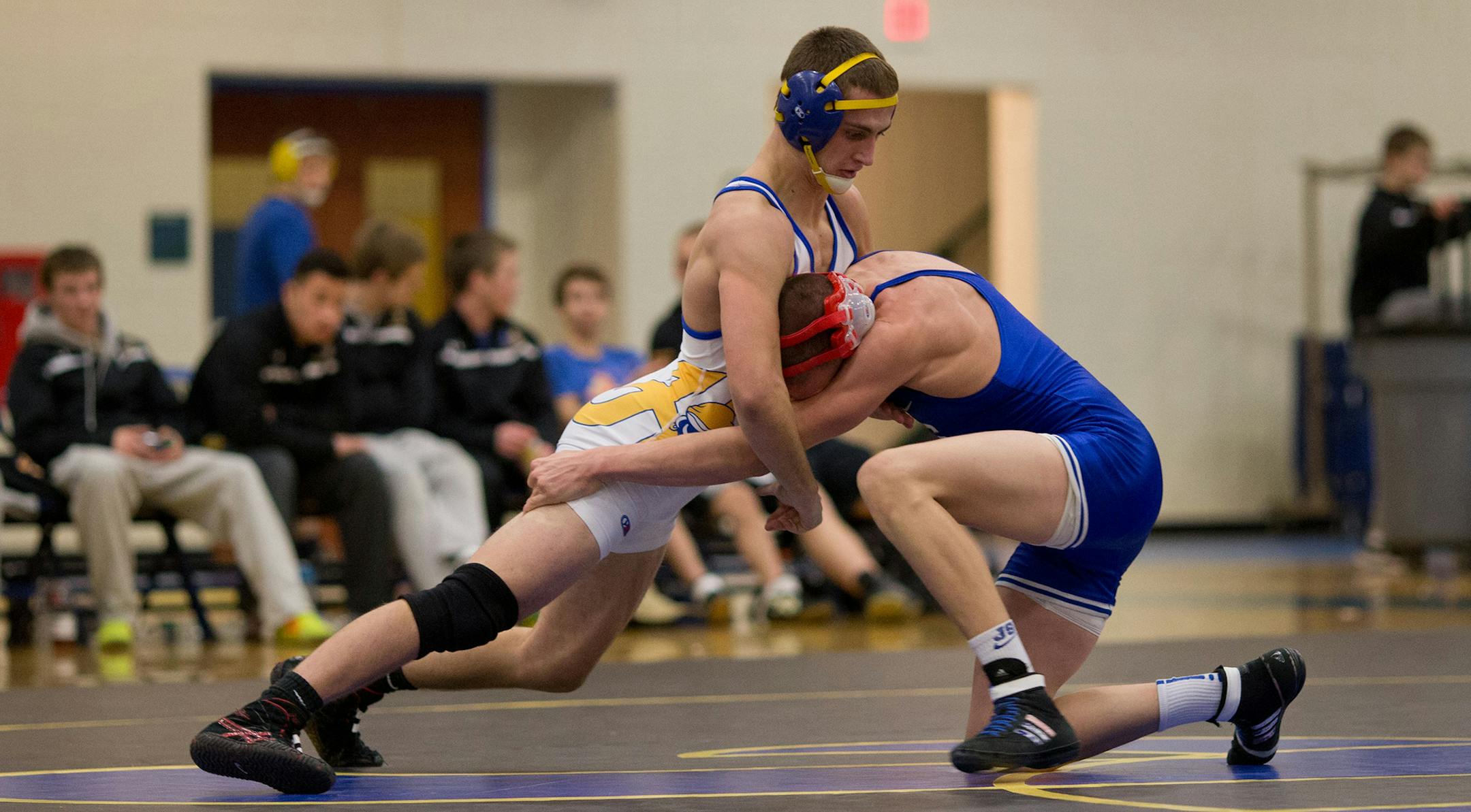 Austin Eichmann, left, Hastings wrestling. Photo by Denny Beck