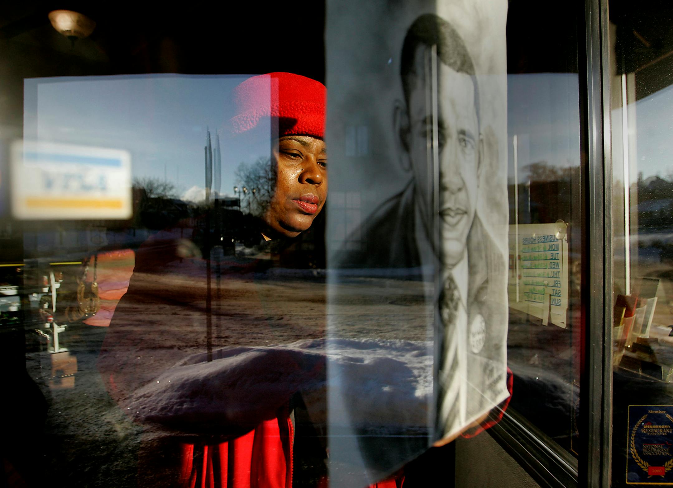 "I believed in him from day one," Tracene Marshall said as she hung a makeshift picture of Barack Obama at the Golden Thyme Coffee Shop in St. Paul. About 80 people squeezed in the community room at Golden Thyme, in the heart of the old Rondo neighborhood, to watch the inauguration on a big-screen TV.