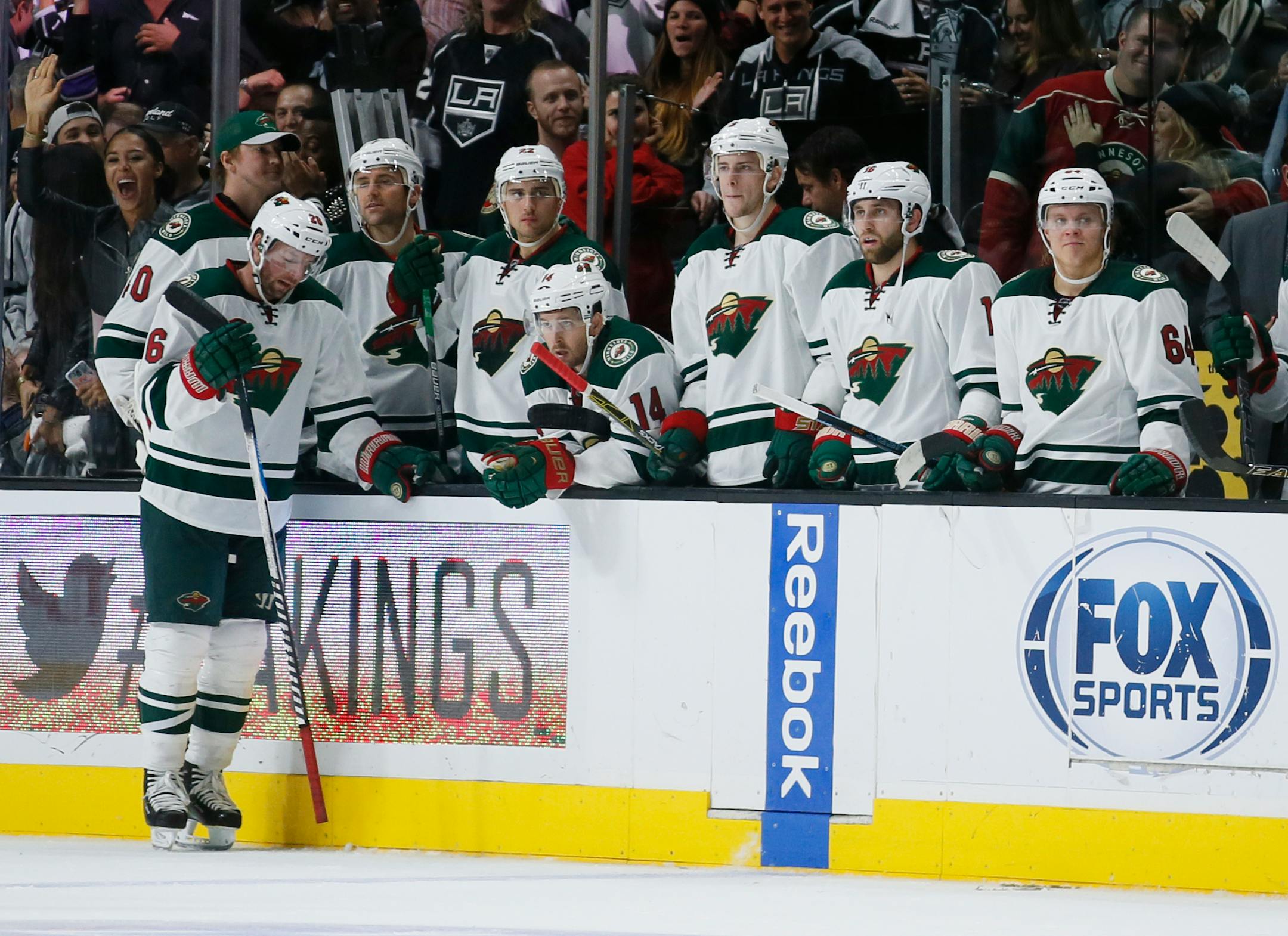 Players on the the Minnesota Wild bench react after Los Angeles Kings center Anze Kopitar scored in overtime during an NHL hockey game, Friday, Oct. 16, 2015, in Los Angeles. The Kings won 2-1. (AP Photo/Danny Moloshok)